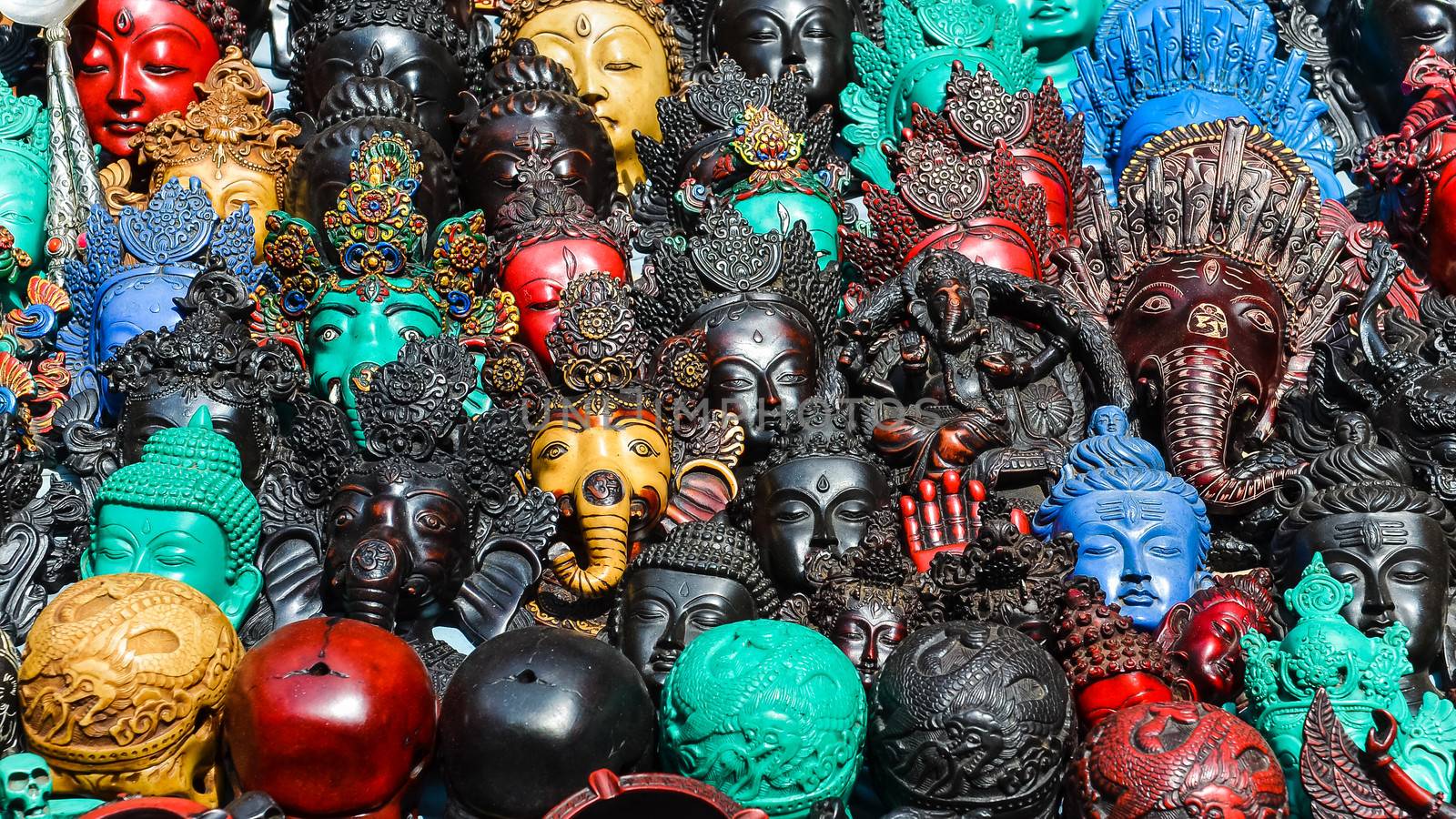 Detail of various wooden carved masks and decorations, market in Kathmandu