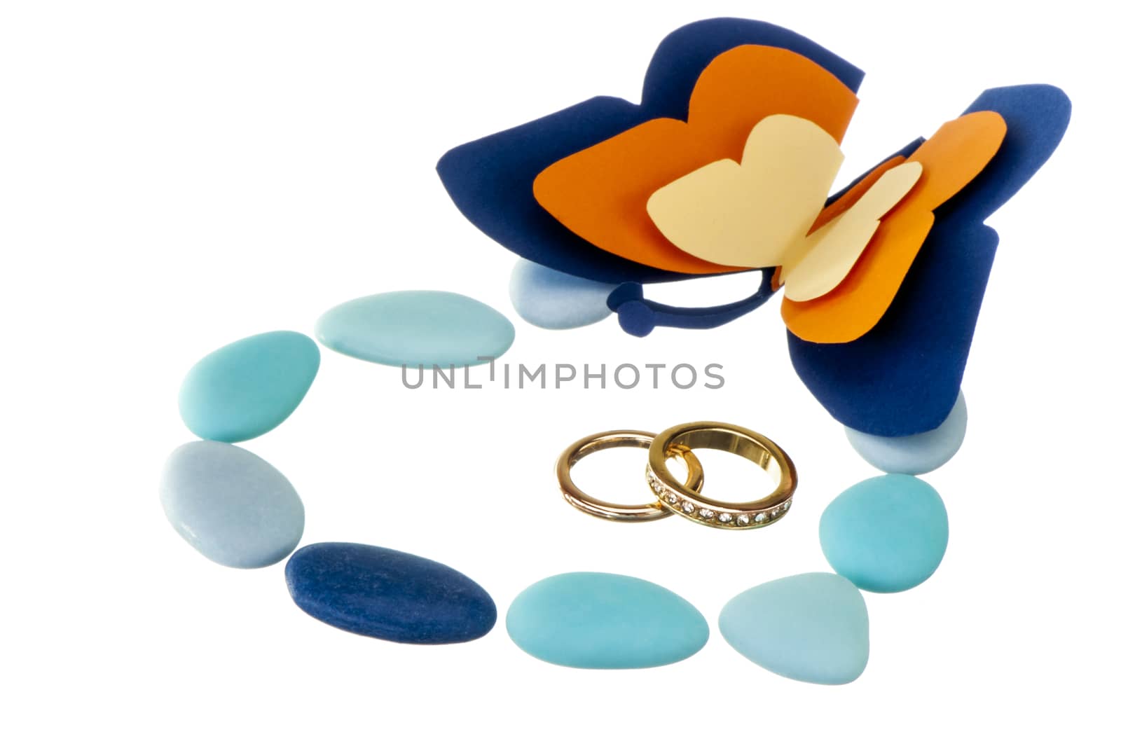 wedding ring  and weddings favors on white background