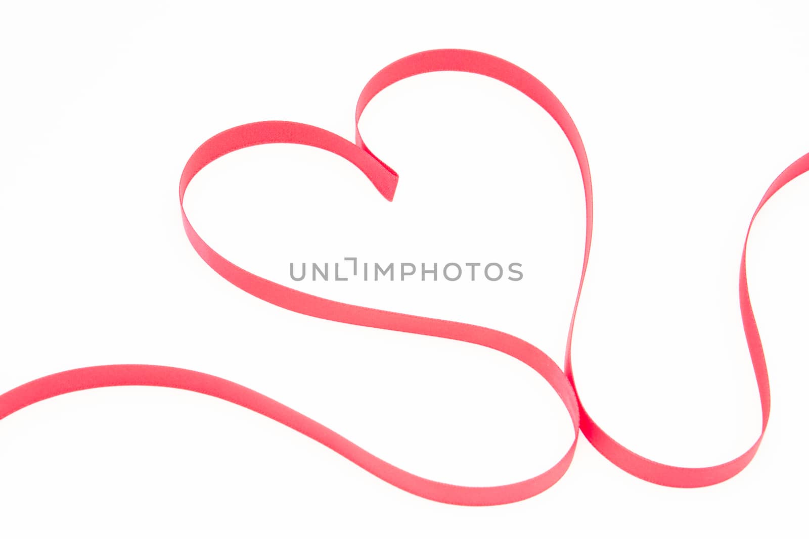 Pink ribbon shaped into heart by Wavebreakmedia
