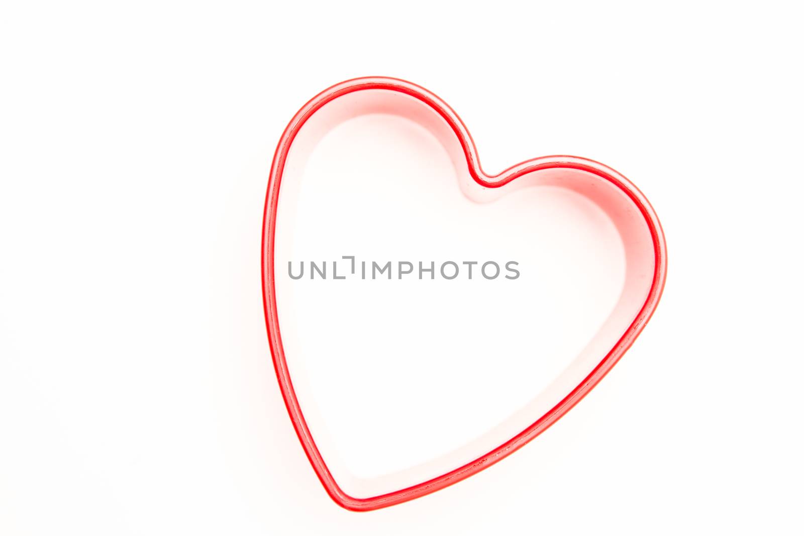 Heart shaped cookie cutter on white background