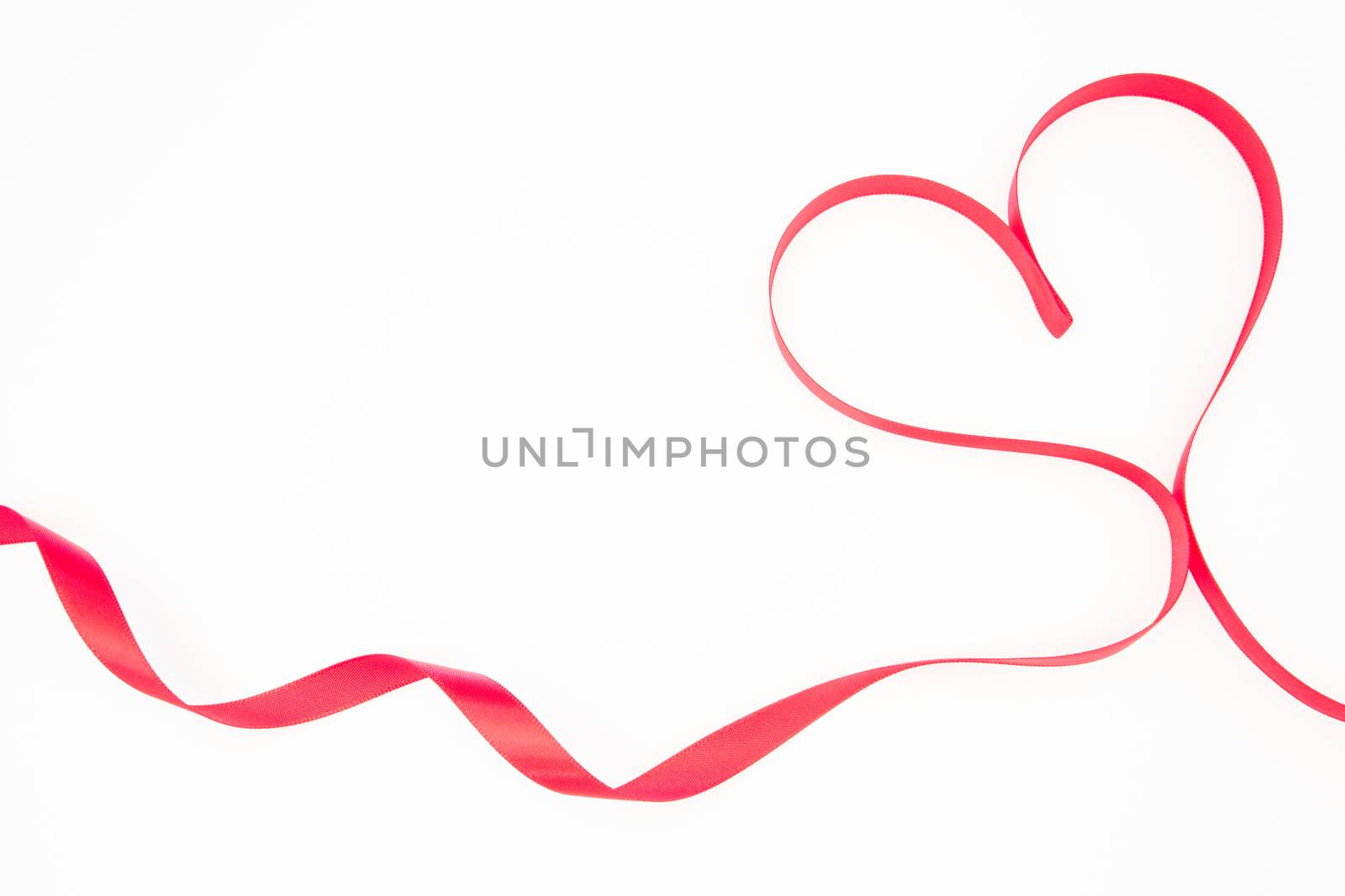 Pink ribbon shaped into heart with copy space by Wavebreakmedia