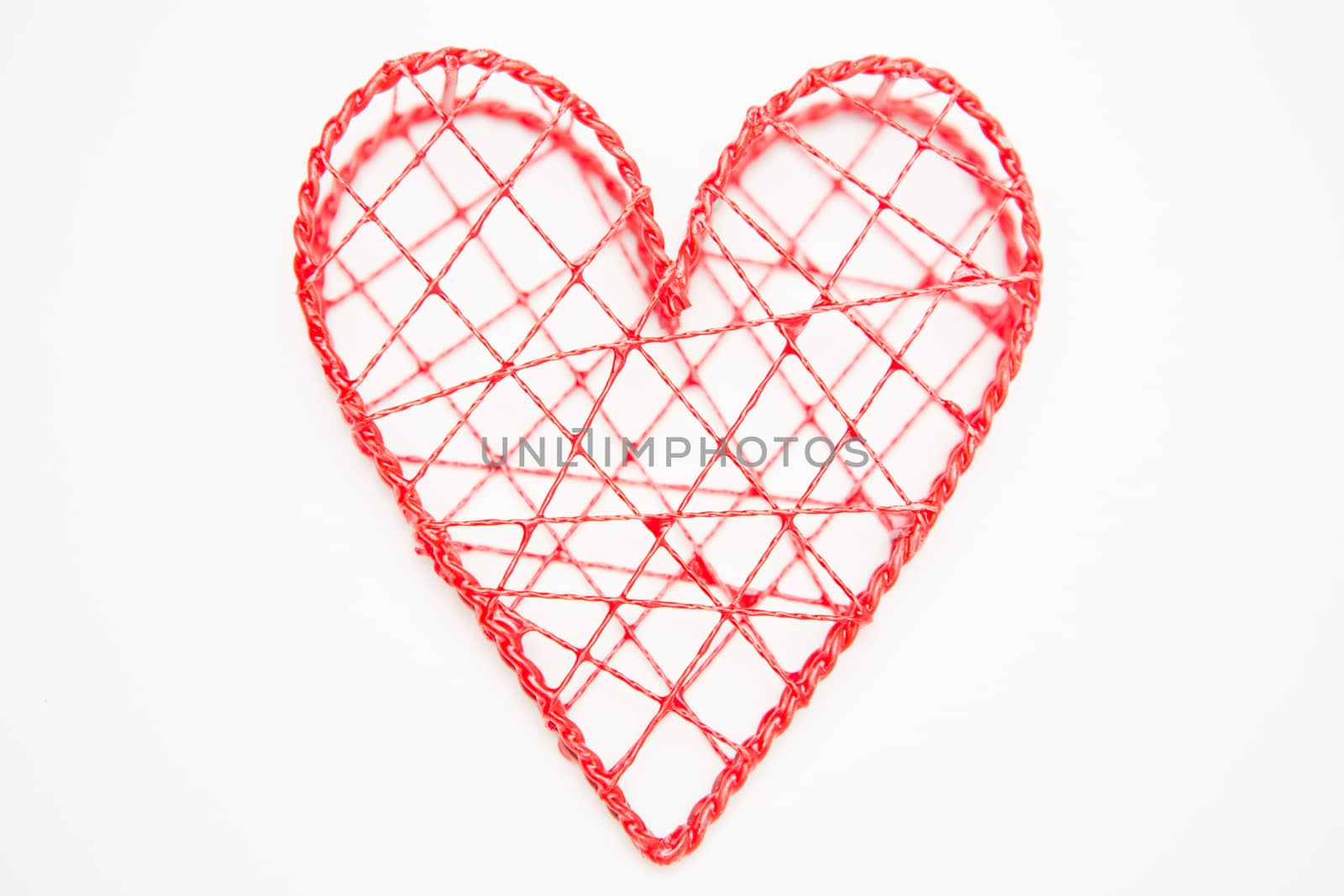 Pink heart shaped box on white background