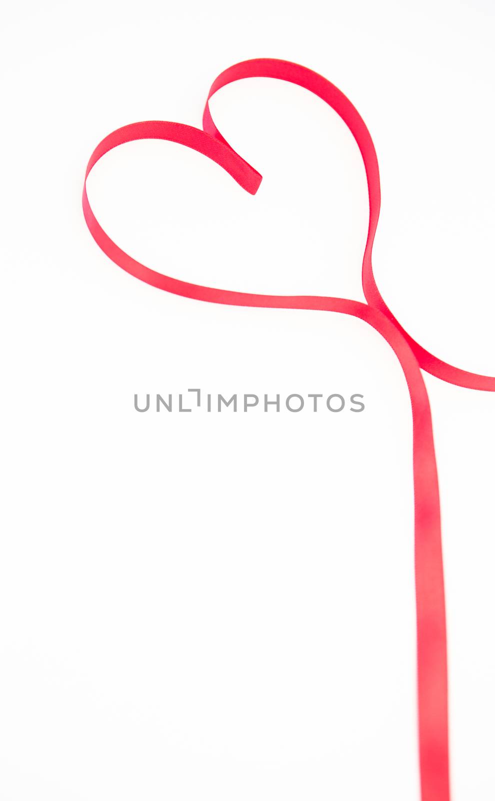 Heart made out of pink ribbon by Wavebreakmedia