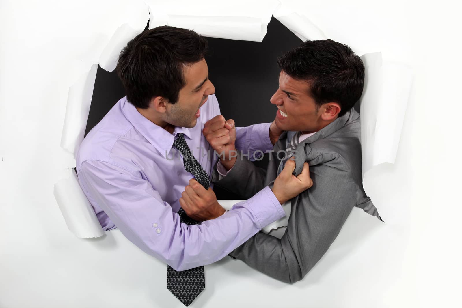 Young businessmen arguing by phovoir
