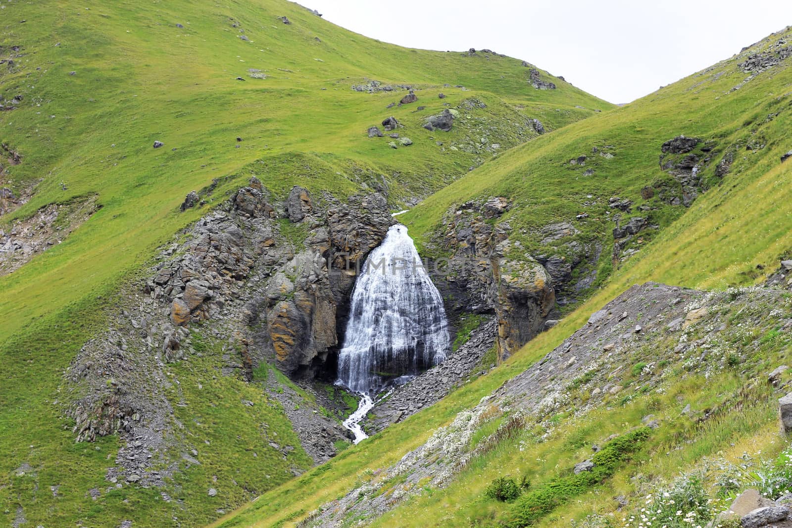 Waterfall Girlish Braids between the mountains of Northern Caucas