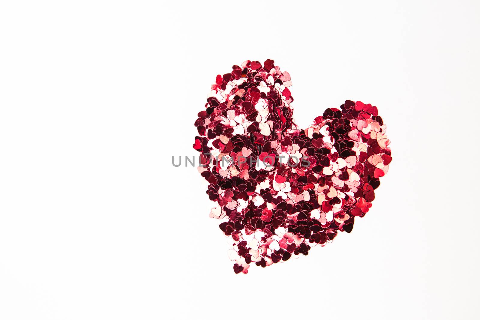 Pink and red confetti in heart shape by Wavebreakmedia