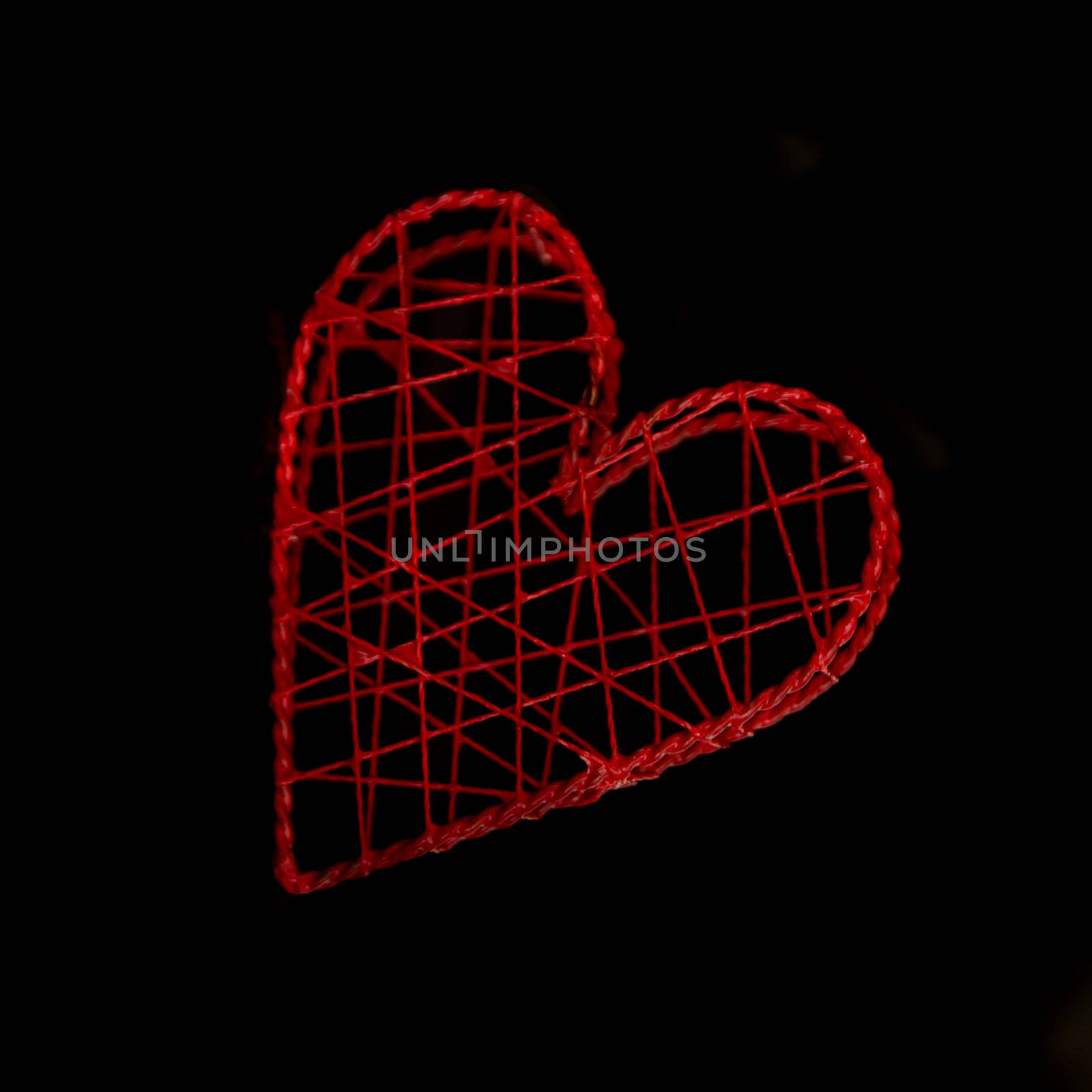 Red heart shaped box on black background