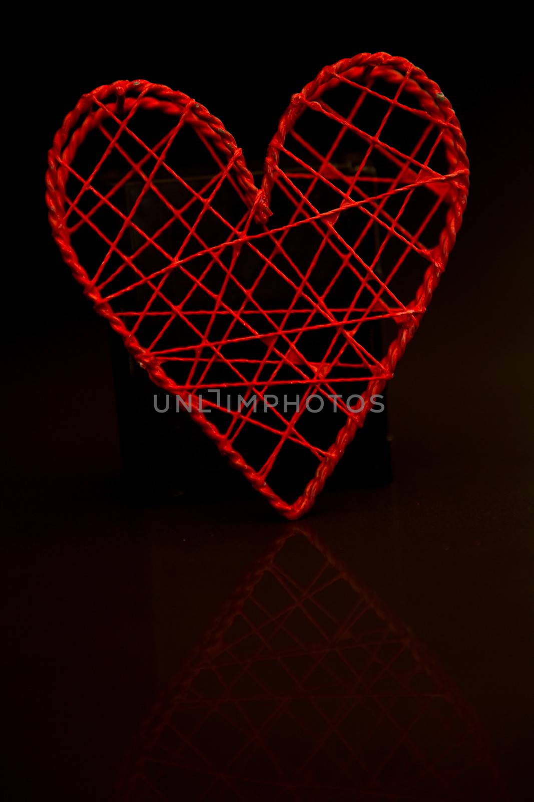 Love heart shaped box on black background