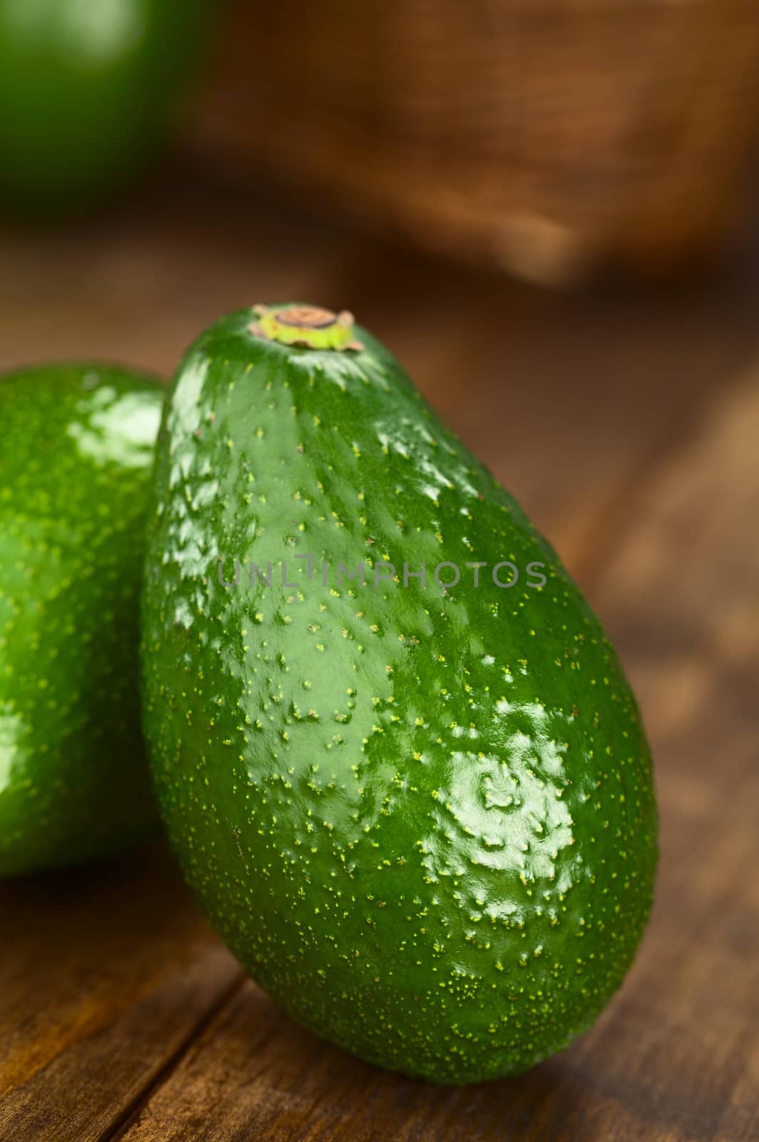 Avocado Fuerte on dark wood (Selective Focus, Focus on the front) 
