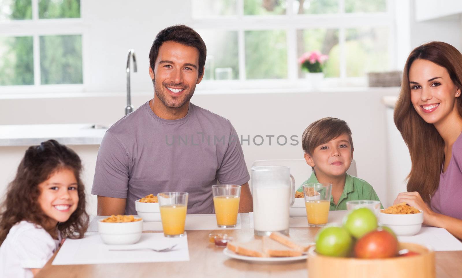 Family having breakfast in kitchen