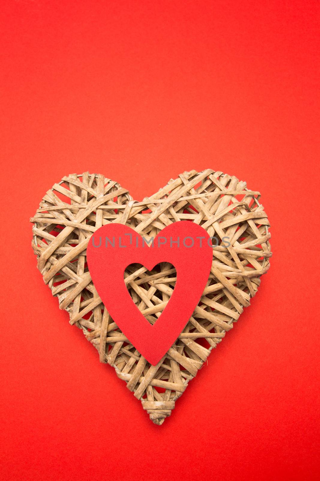 Wicker heart ornament with red cut out by Wavebreakmedia