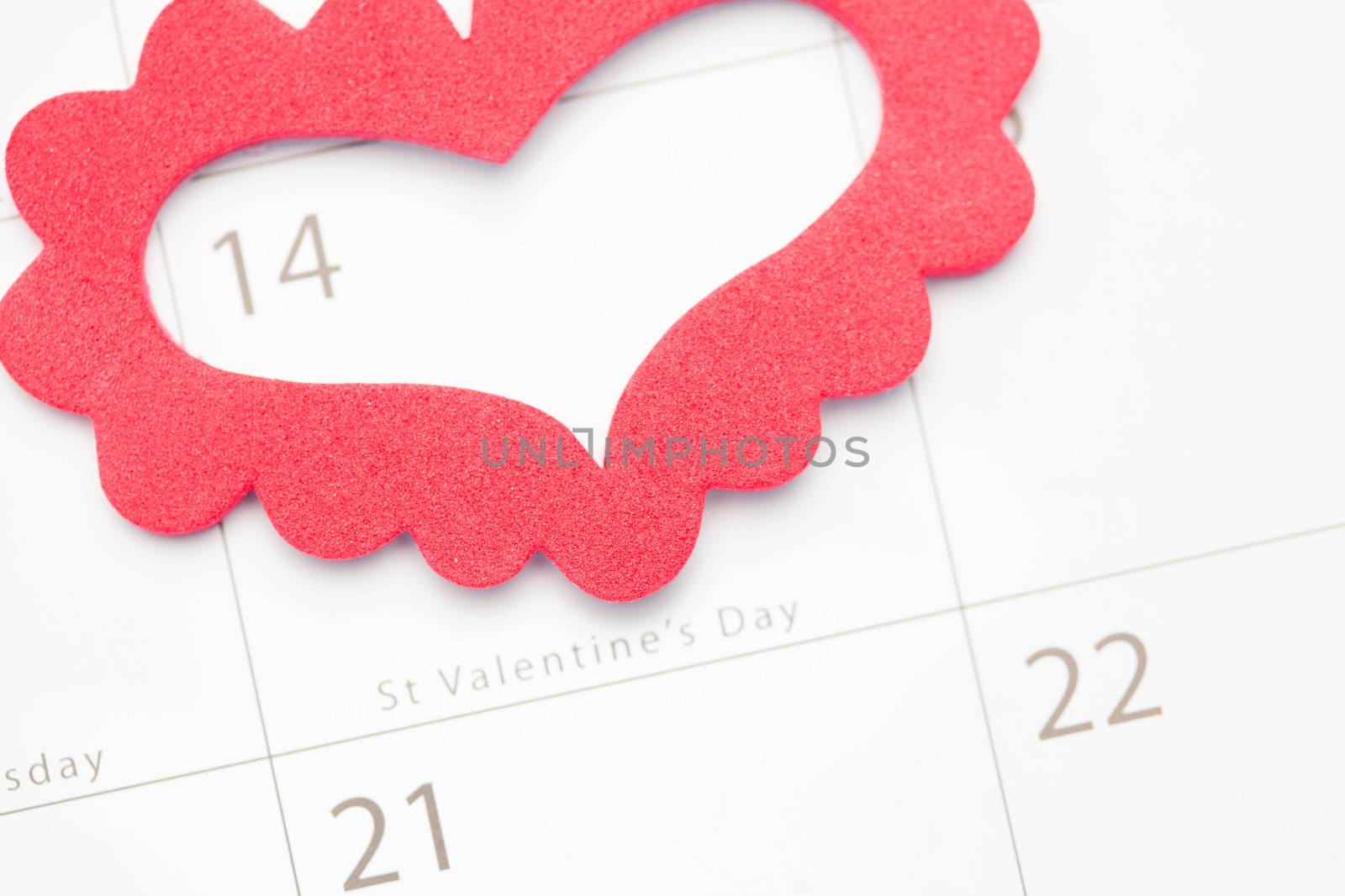 Pink heart marking out valentines day on white calendar
