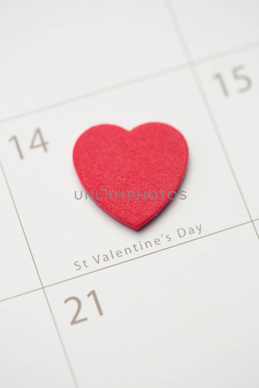 Zoom on pink heart marking valentines day on calendar