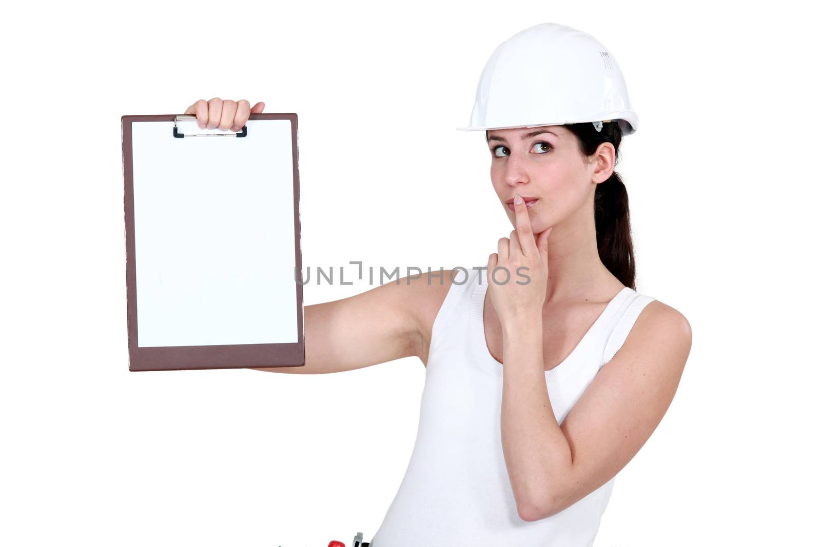 Woman with clip-board making shush gesture by phovoir
