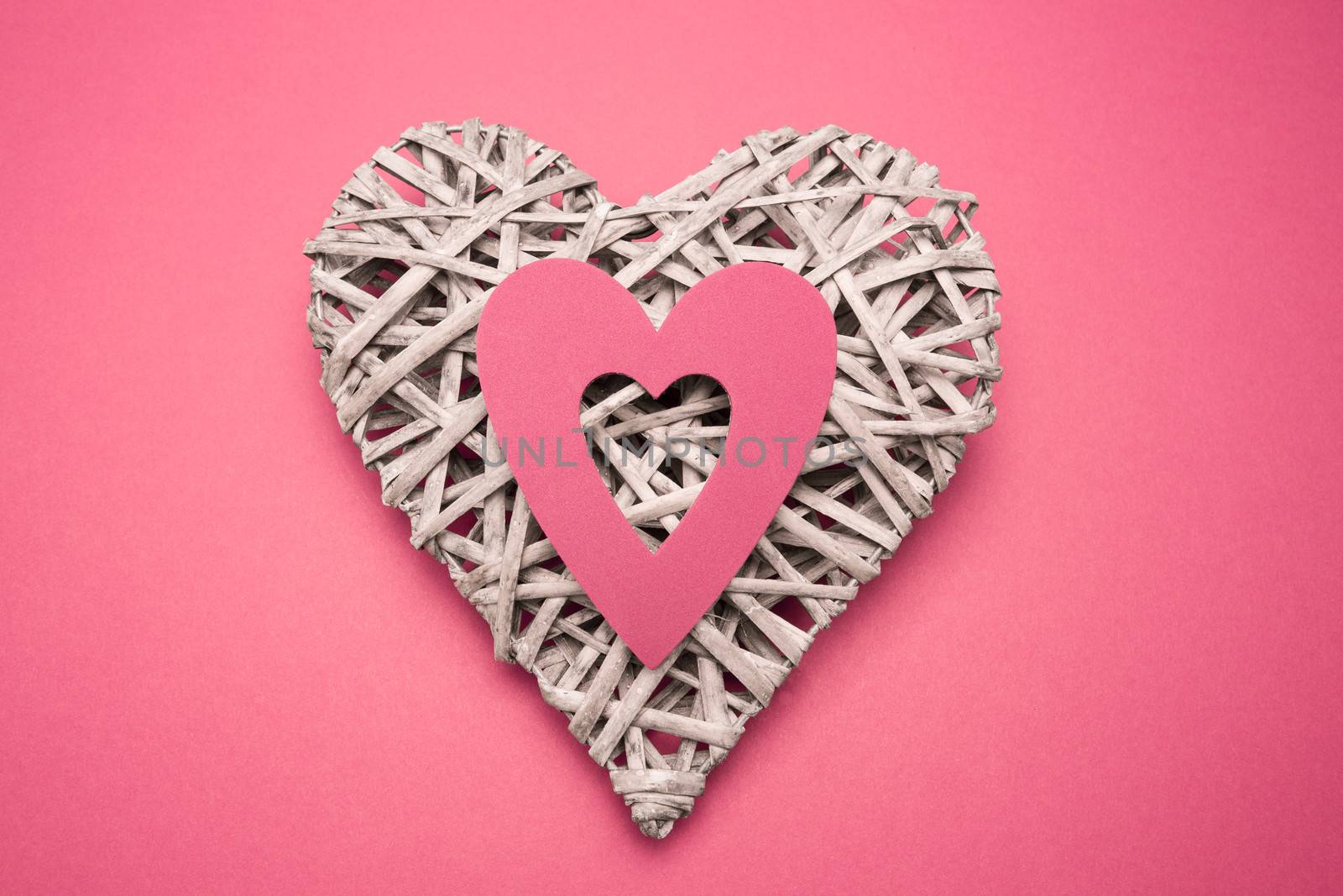 Wicker heart ornament with paper cut out by Wavebreakmedia