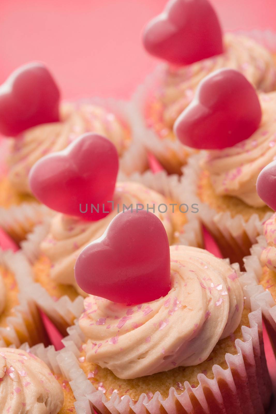 Close up of valentines cupcakes on pink background