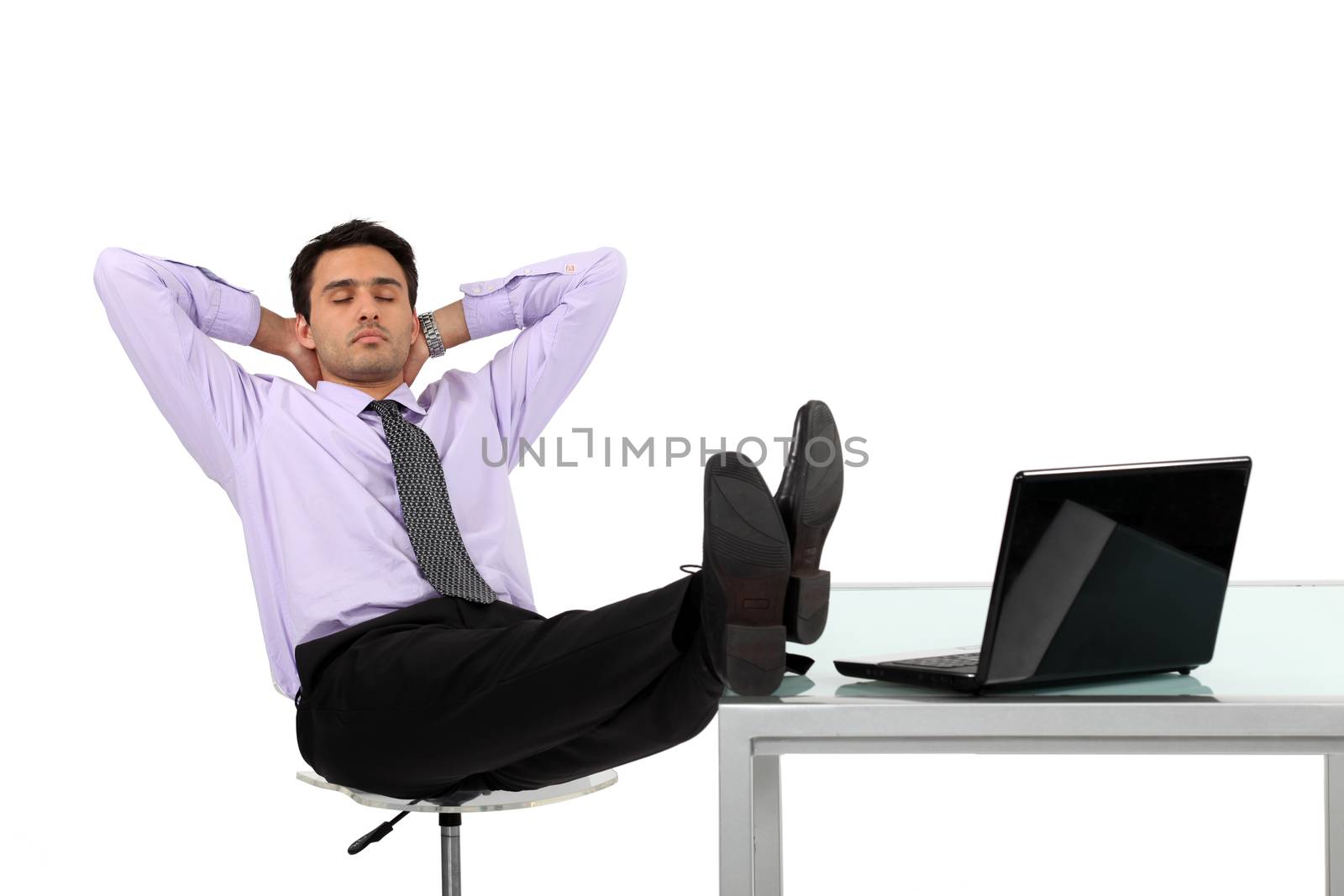 Businessman relaxing at his desk