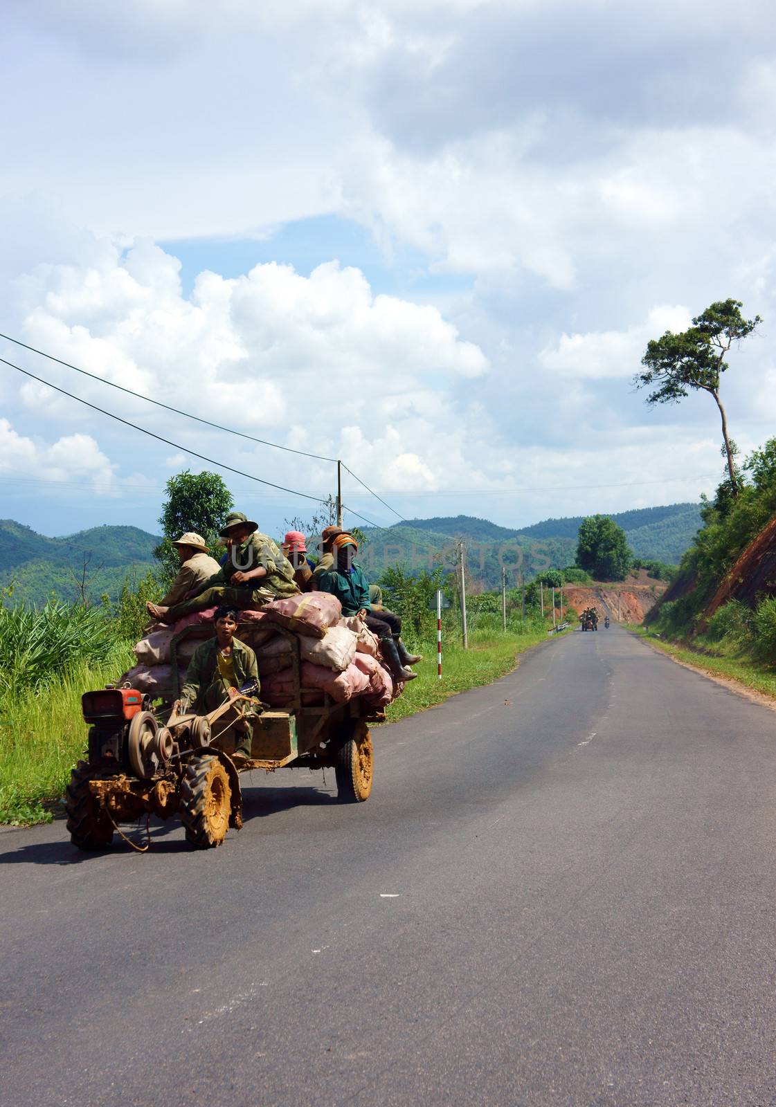 Cong Nong is one of farm vehicle of ethinic minority, after working day, all of them carry to go home by Cong Nong. Daklak, Viet Nam- September 03, 2013