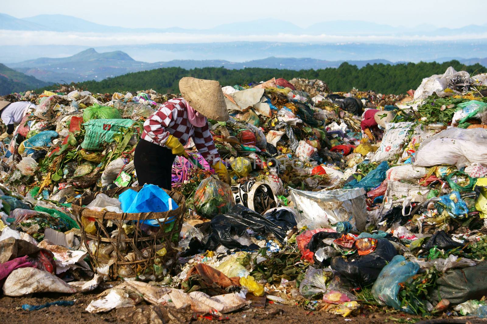 Many people make their live by pick up waste, someone pick up along street, these people concentrate at rubbish dump, they work all day here. Viet Nam- September 05, 2013