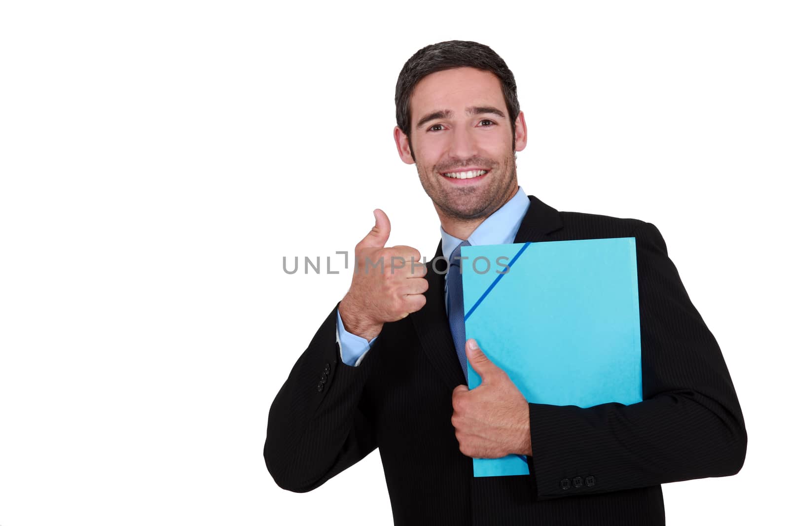 Businessman holding a folder and giving the thumb's up by phovoir