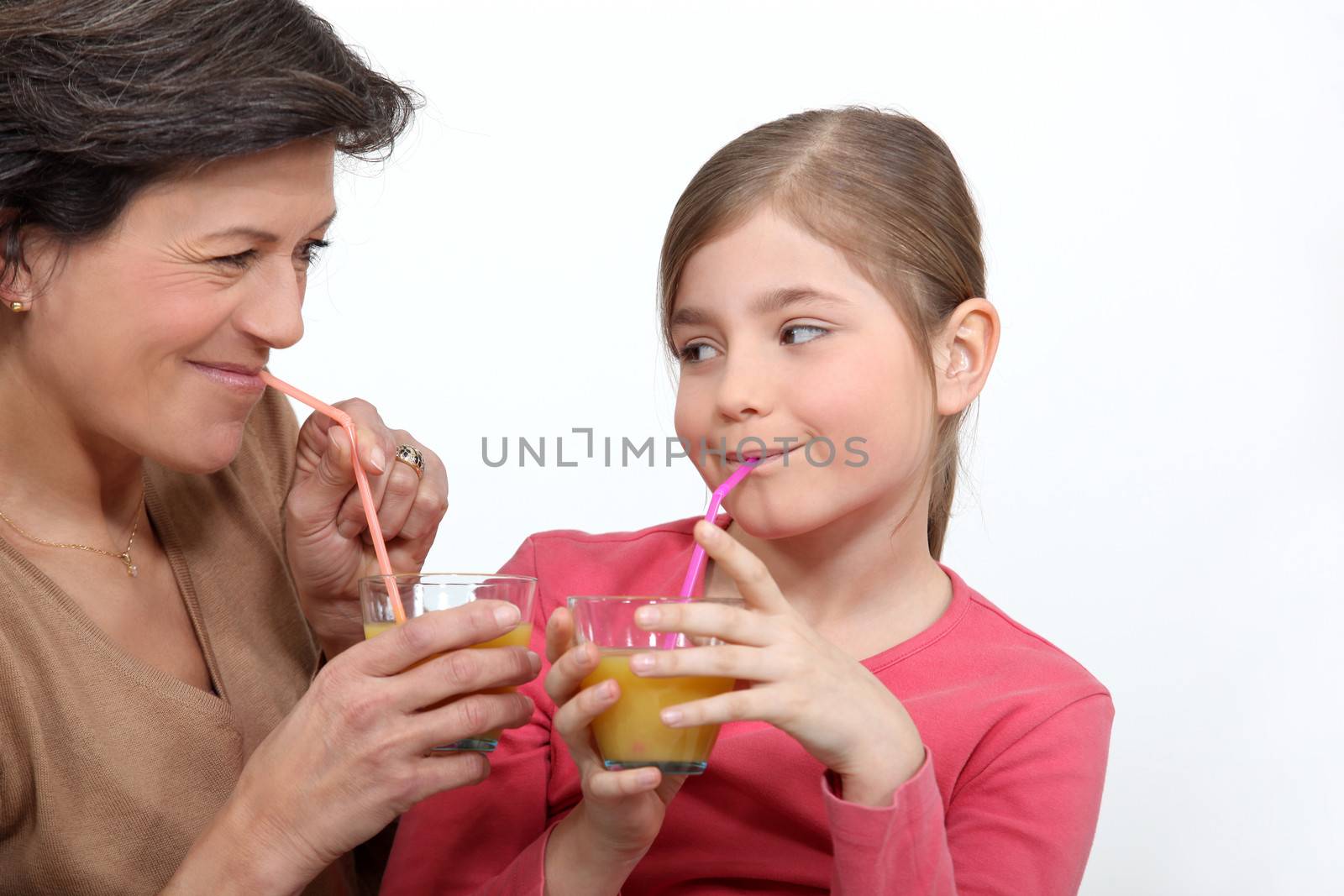 Woman and girl drinking