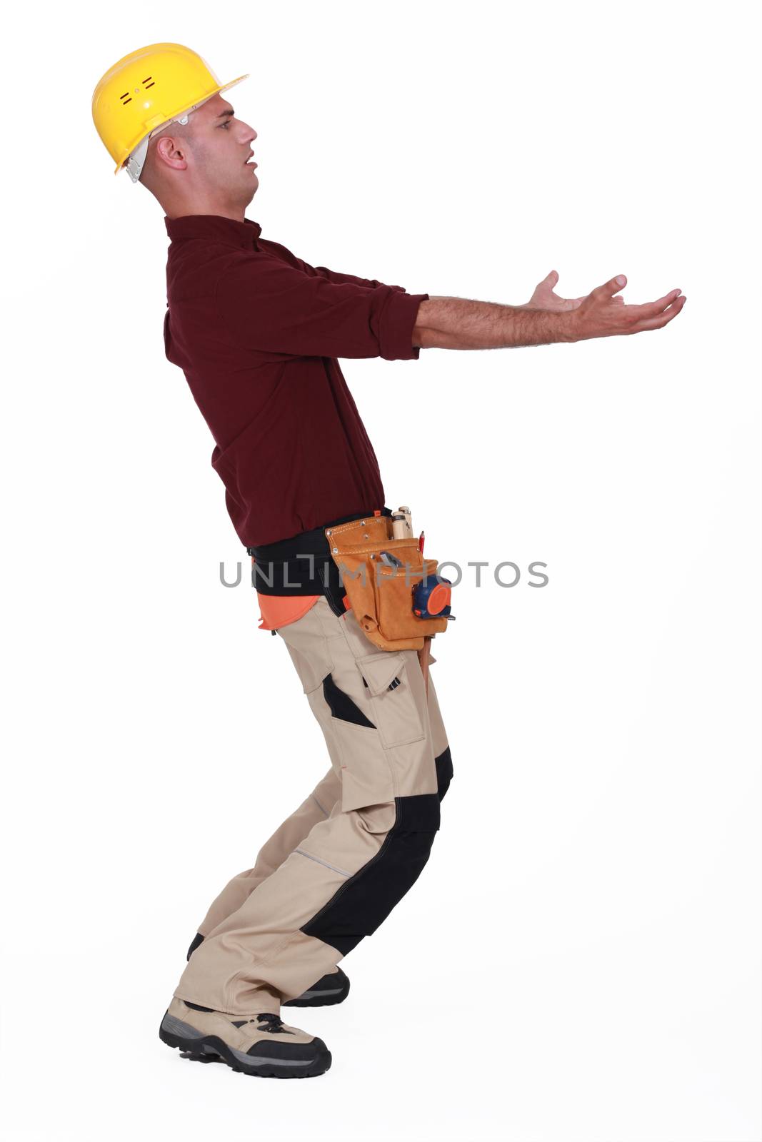 Construction worker carrying something
