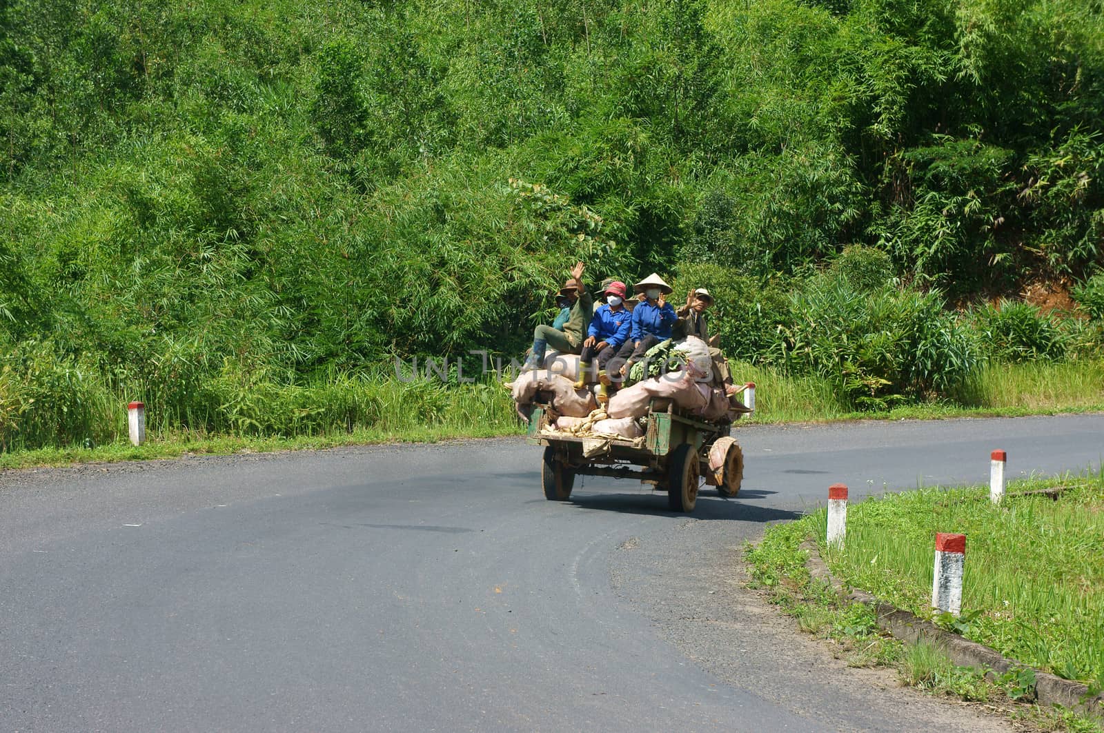 Cong Nong is one of farm vehicle of ethinic minority, after working day, all of them carry to go home by Cong Nong. Daklak, Viet Nam- September 03, 2013