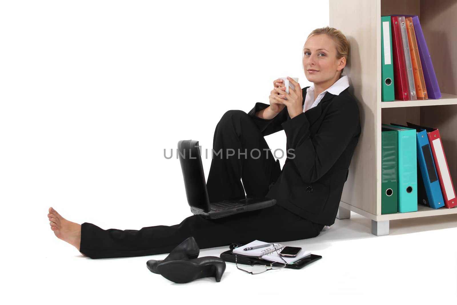 Young woman relaxed in front of computer by phovoir