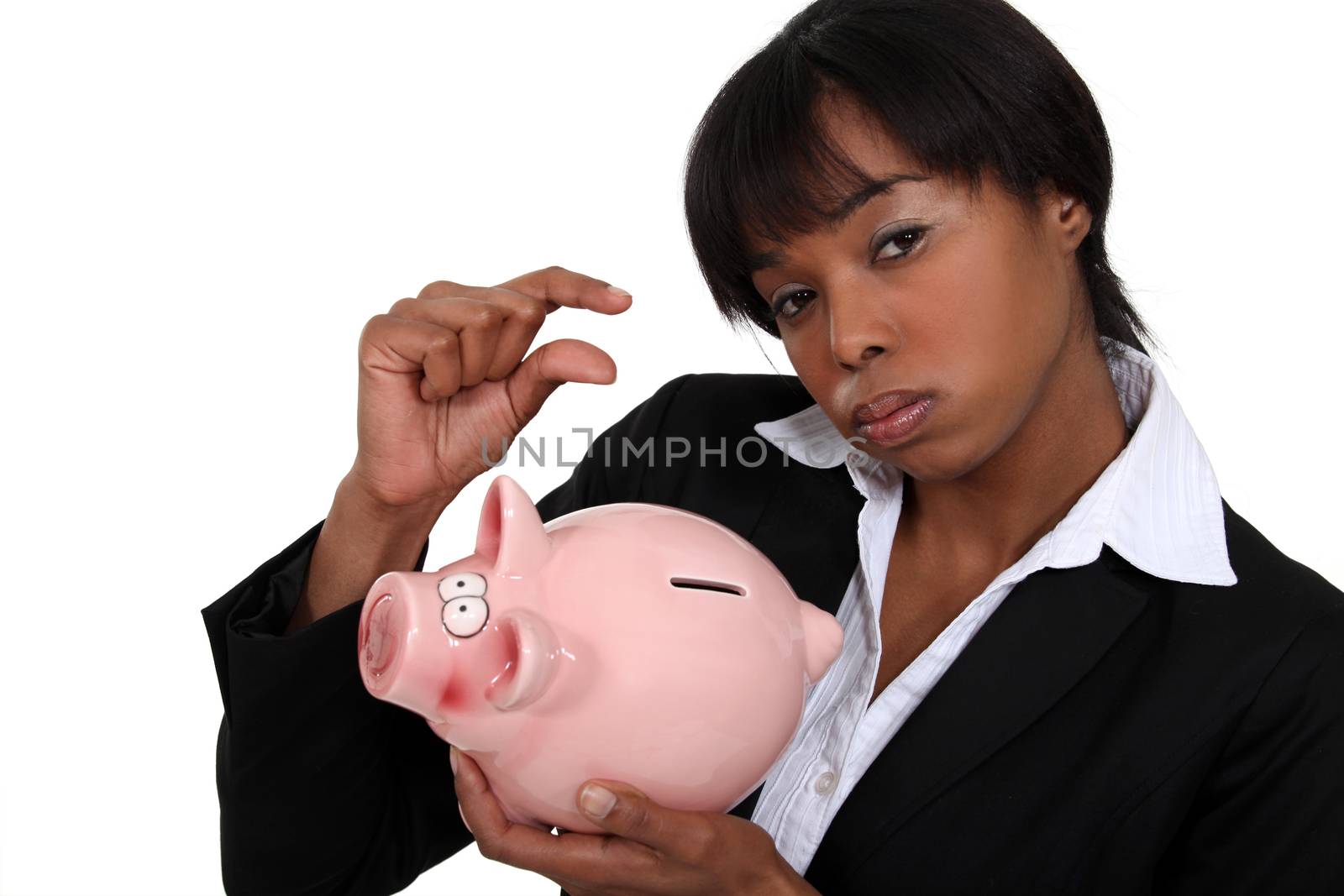 Businesswoman with a piggy bank by phovoir