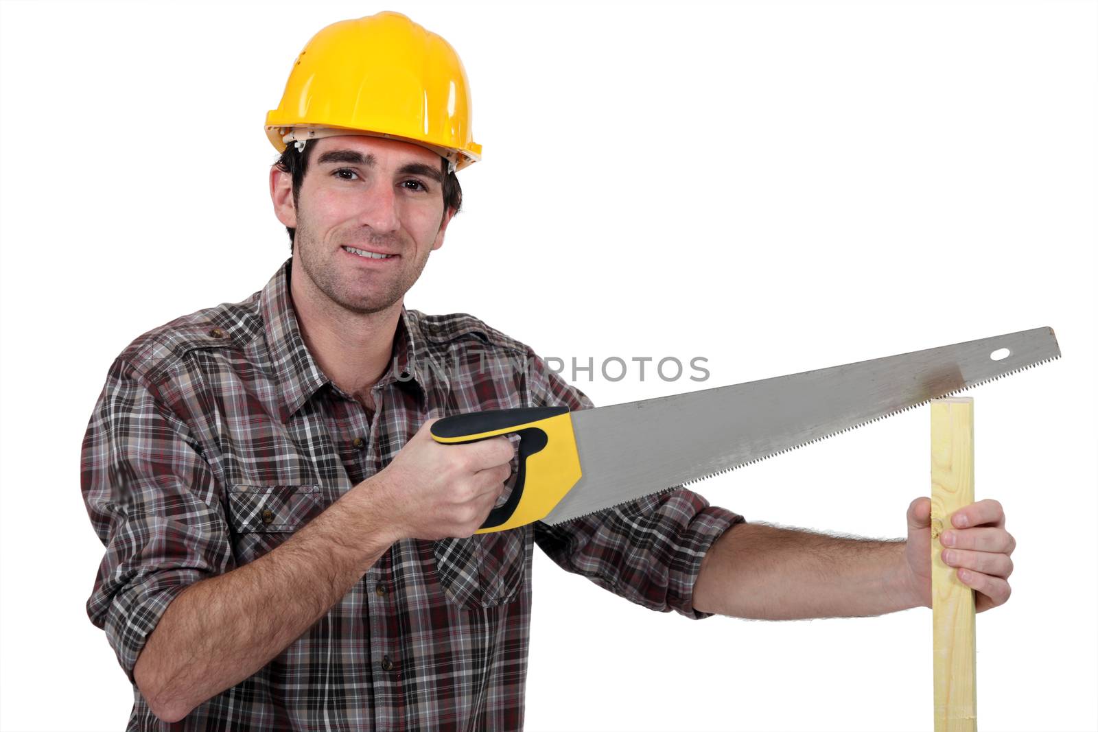 Man sawing plank of wood by phovoir