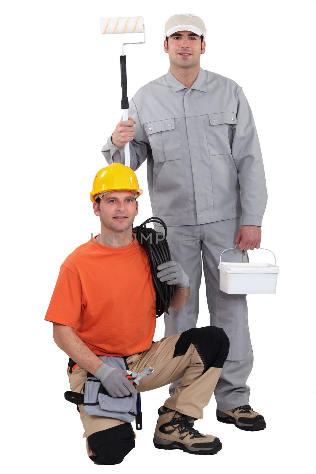 Electrician kneeling by painter by phovoir