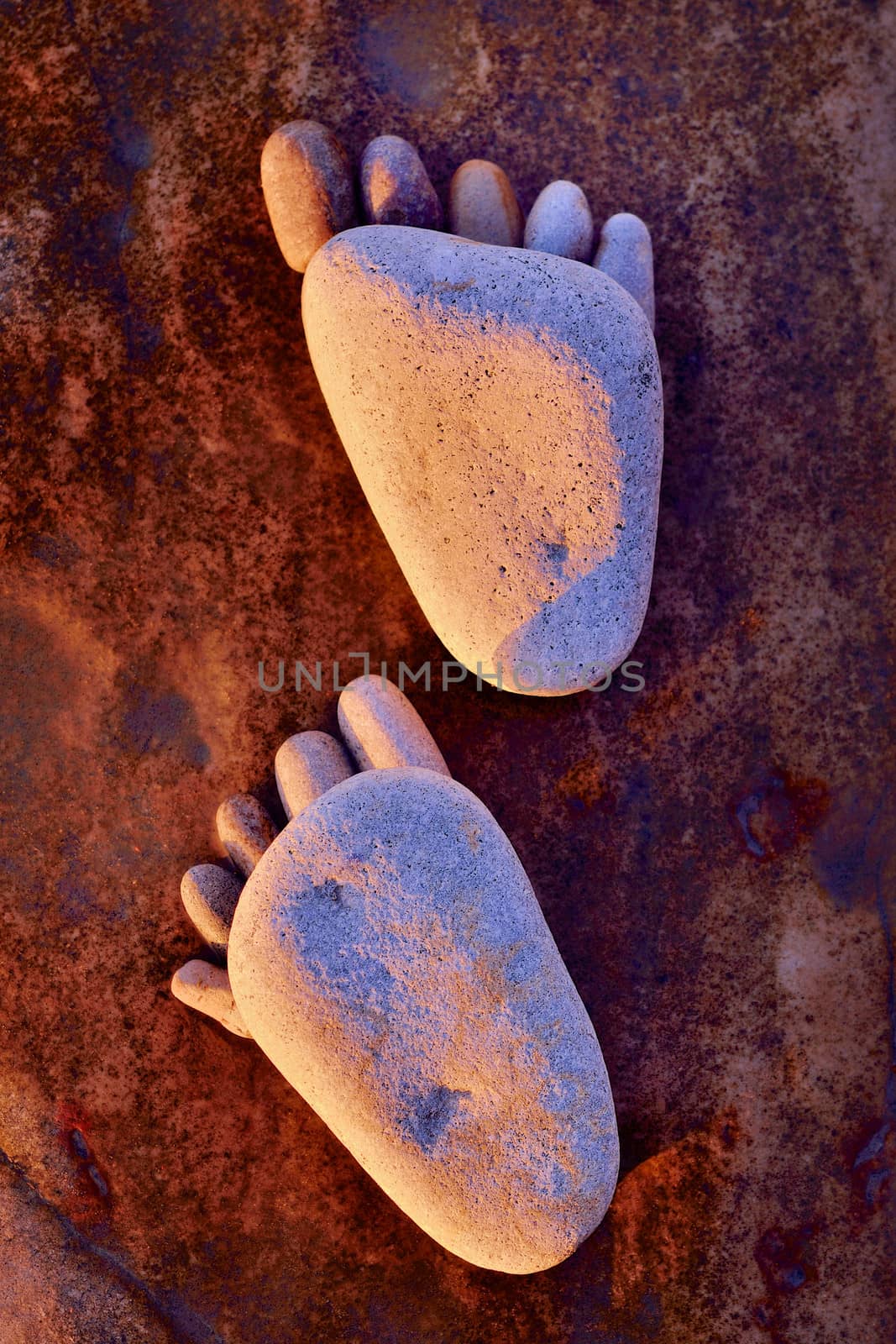 Footsteps of pebbles on the rocky coast