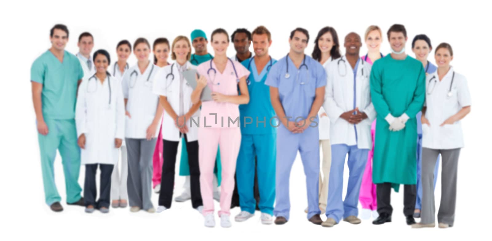 Happy team of smiling doctors standing together  by Wavebreakmedia