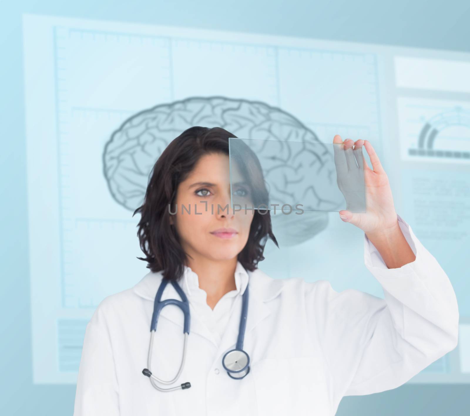 Doctor using a new technology in front of brain sketch in the hospital