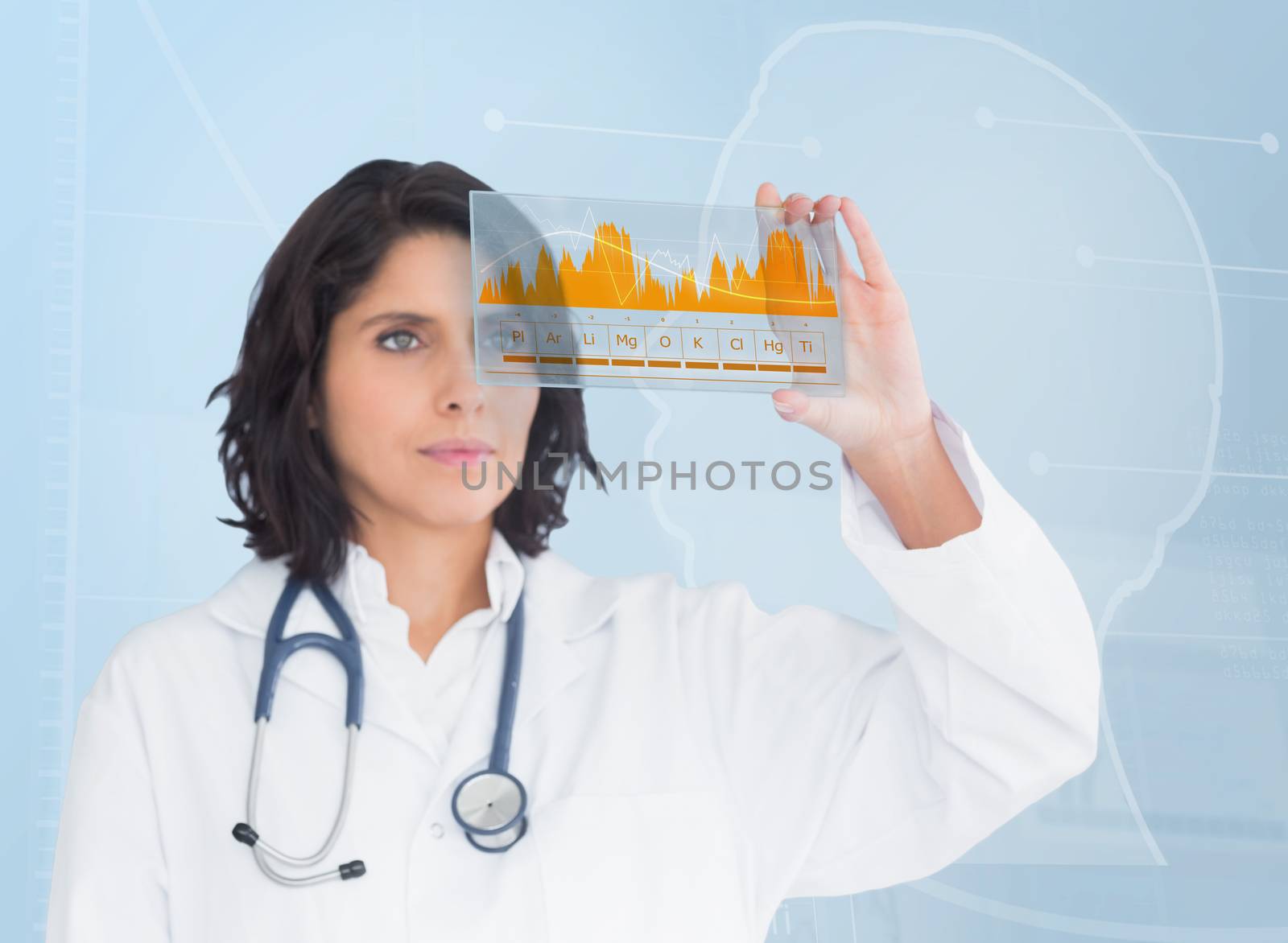 Brunette doctor looking at a graph with new technology by Wavebreakmedia