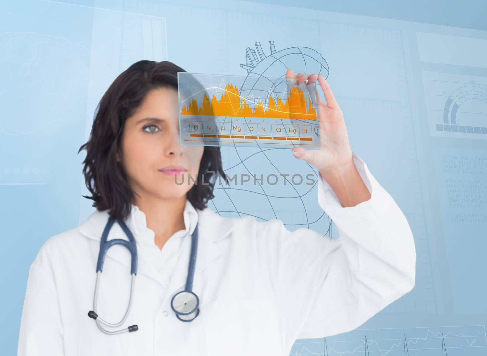 Brunette doctor looking at a graph with futuristic technology by Wavebreakmedia