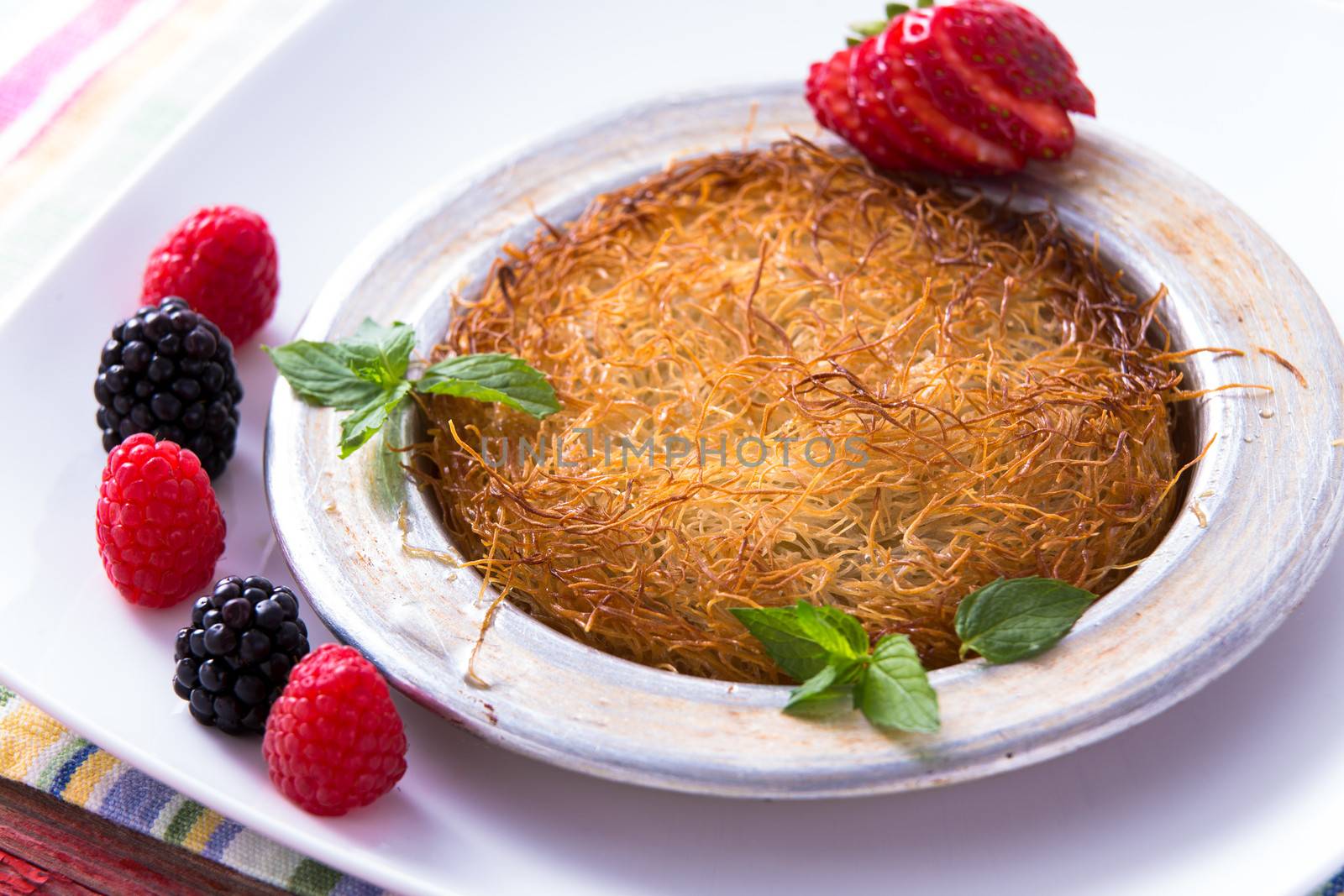 Kunefe, Turkish Dessert with berries by coskun