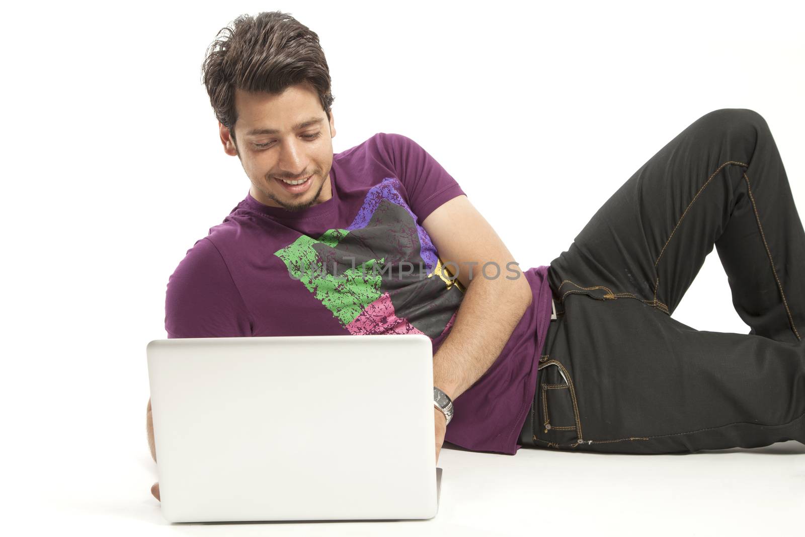 young male relaxed working on laptop
