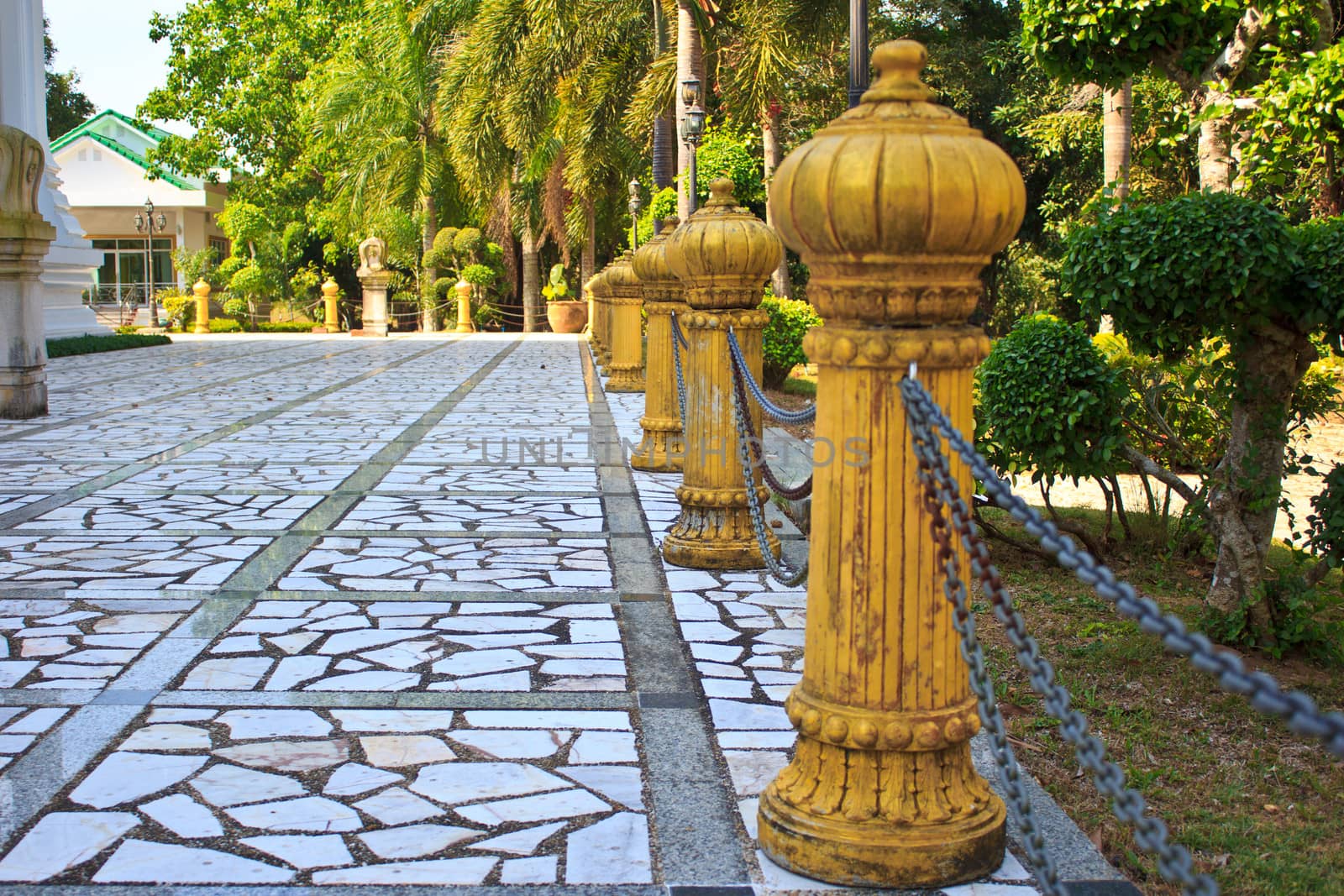 chain around yellow pillar in Temple of The Wat Rhai Pa, Trat, Thailand