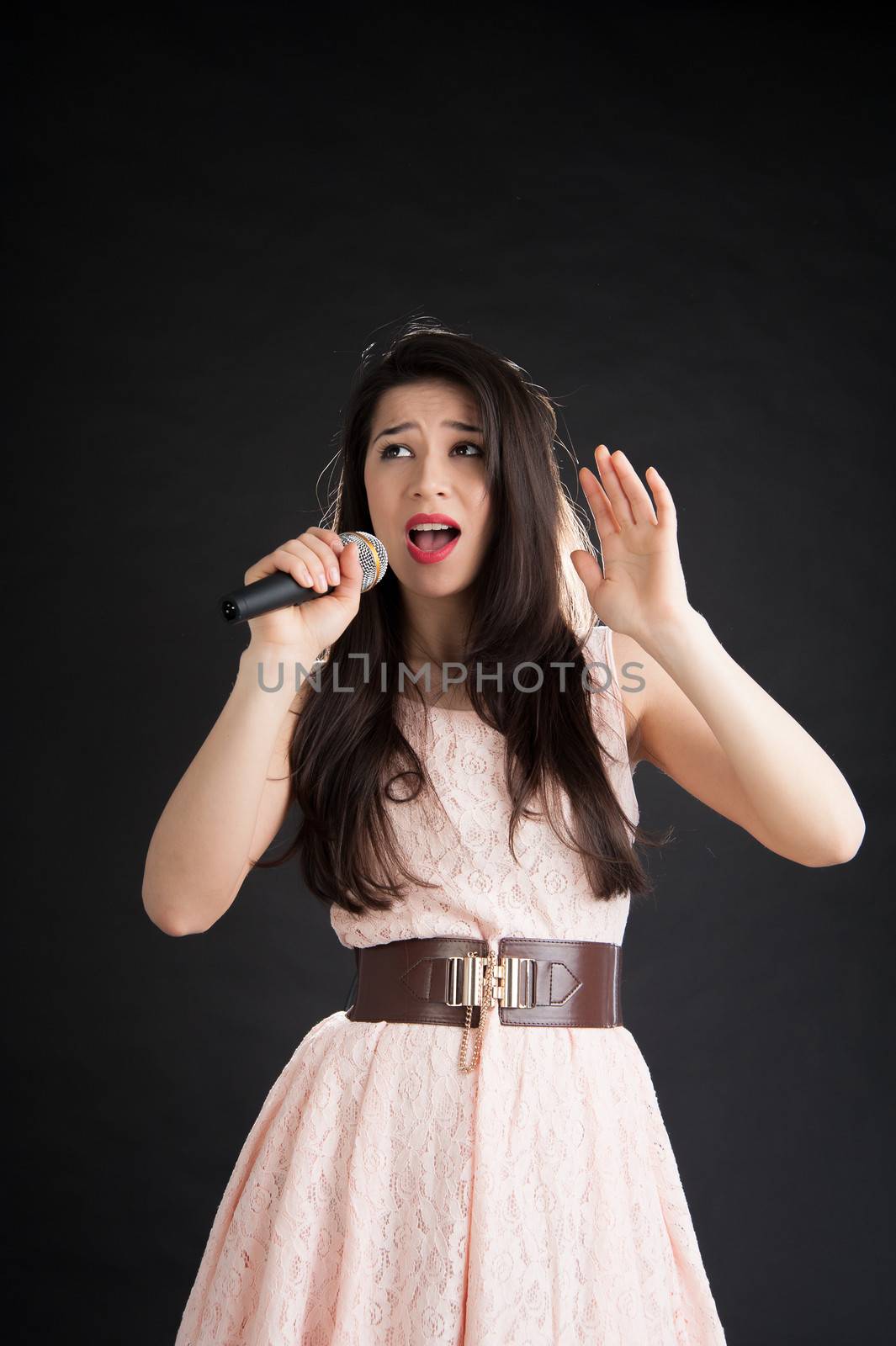 pop singer on a black background