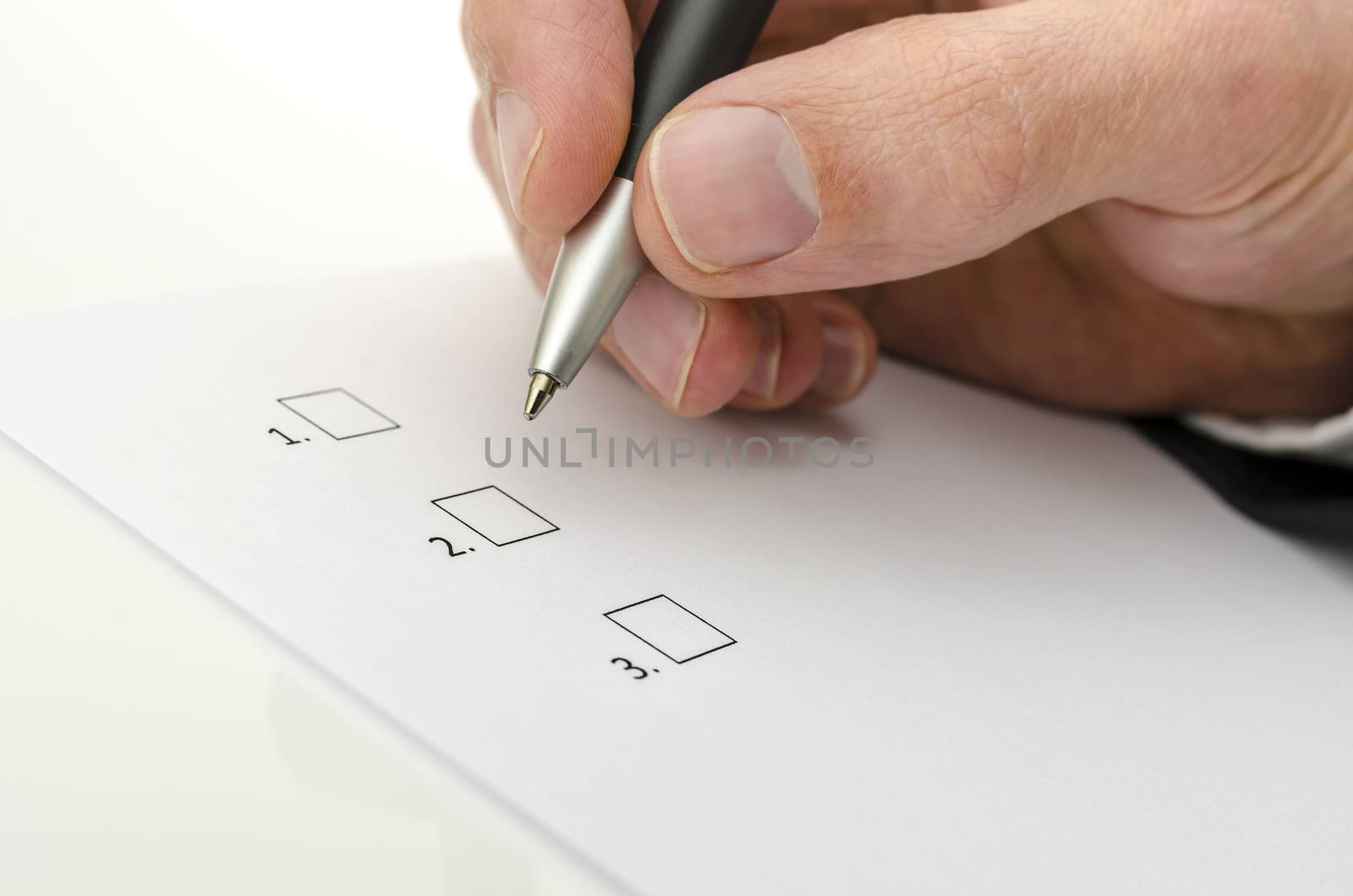 Detail of business man hand choosing one of the options.