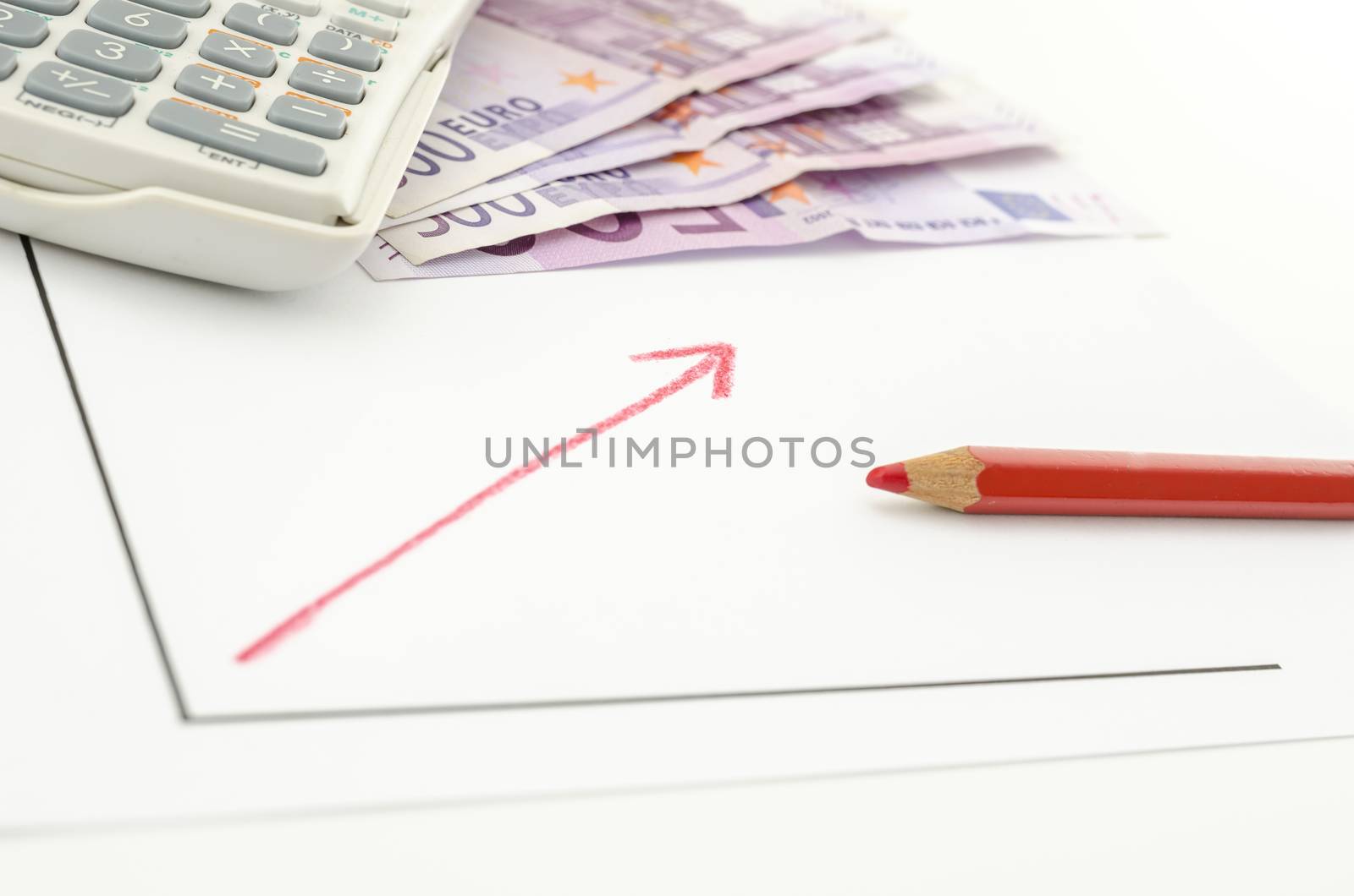 Growing business graph with red arrow with Euro banknotes and calculator in background.