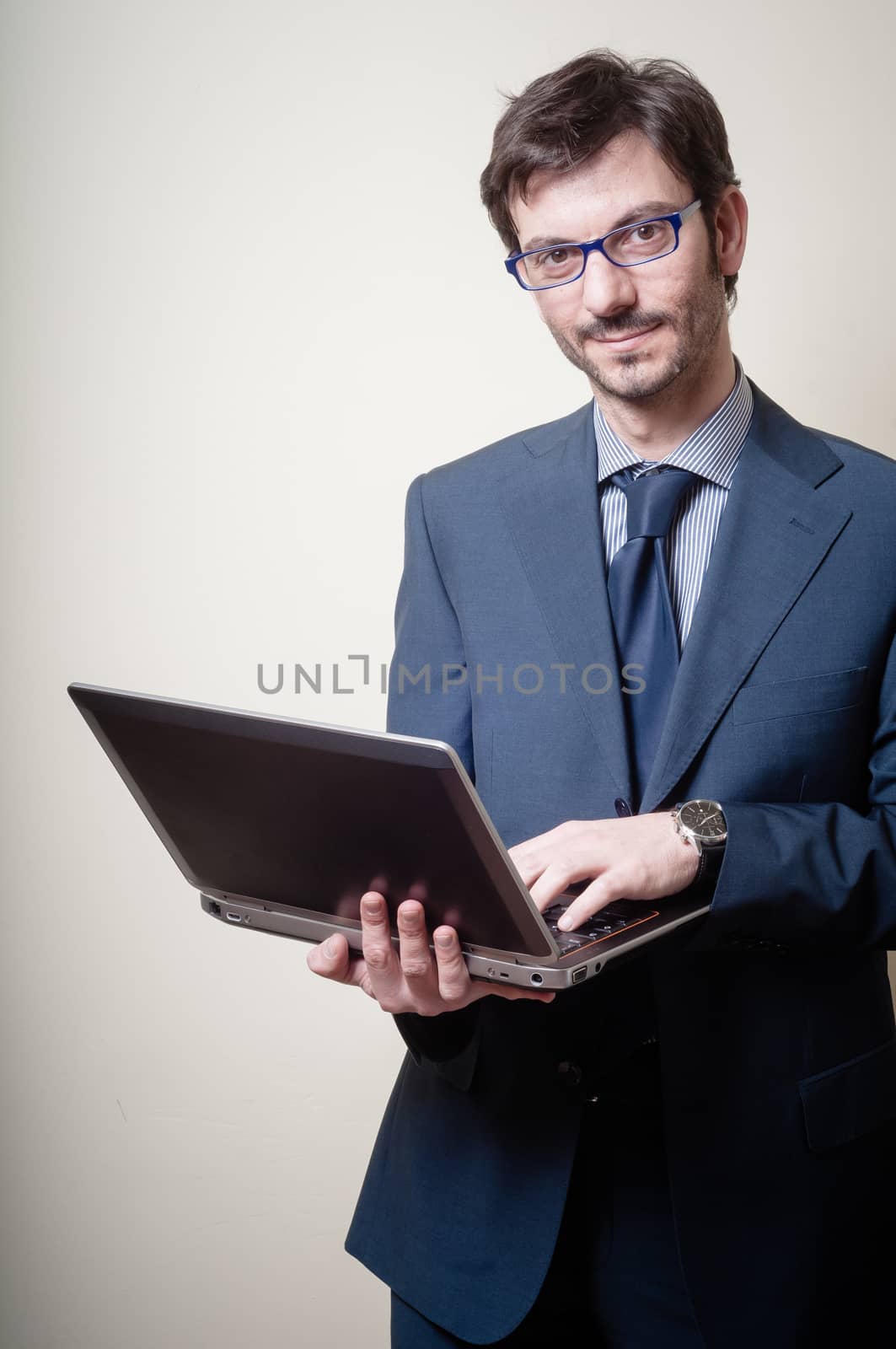 businessman with notebook on gray background