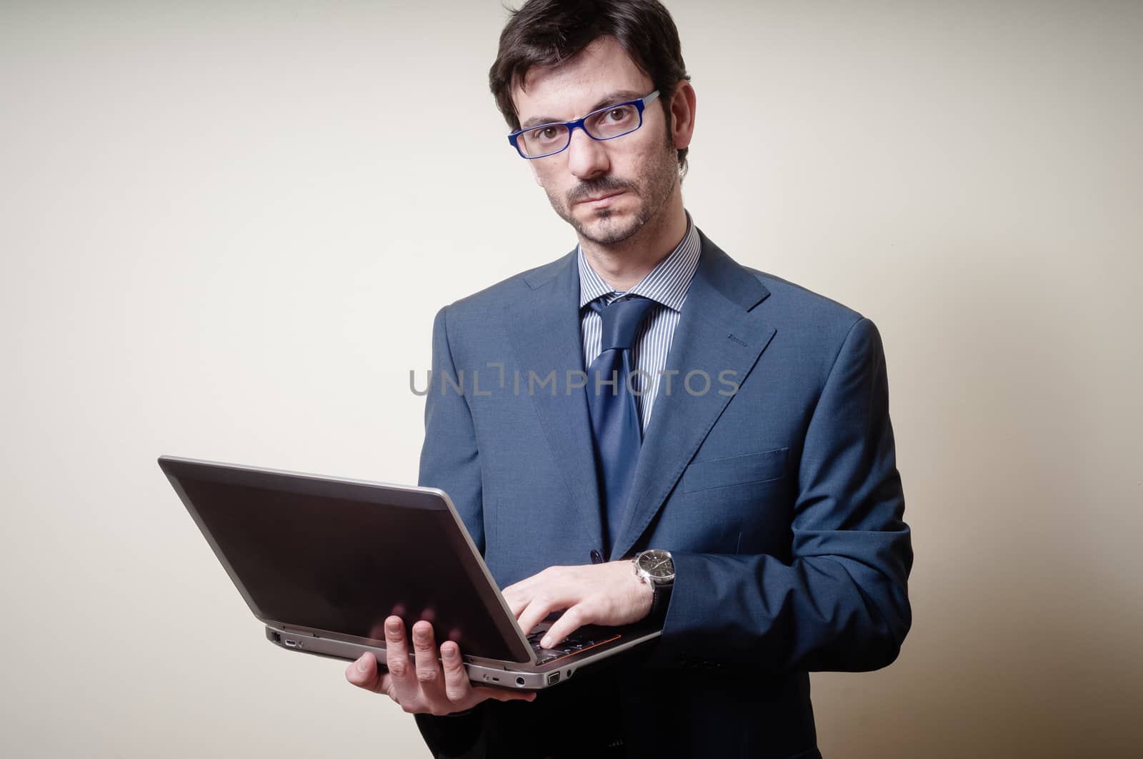 businessman with notebook on gray background