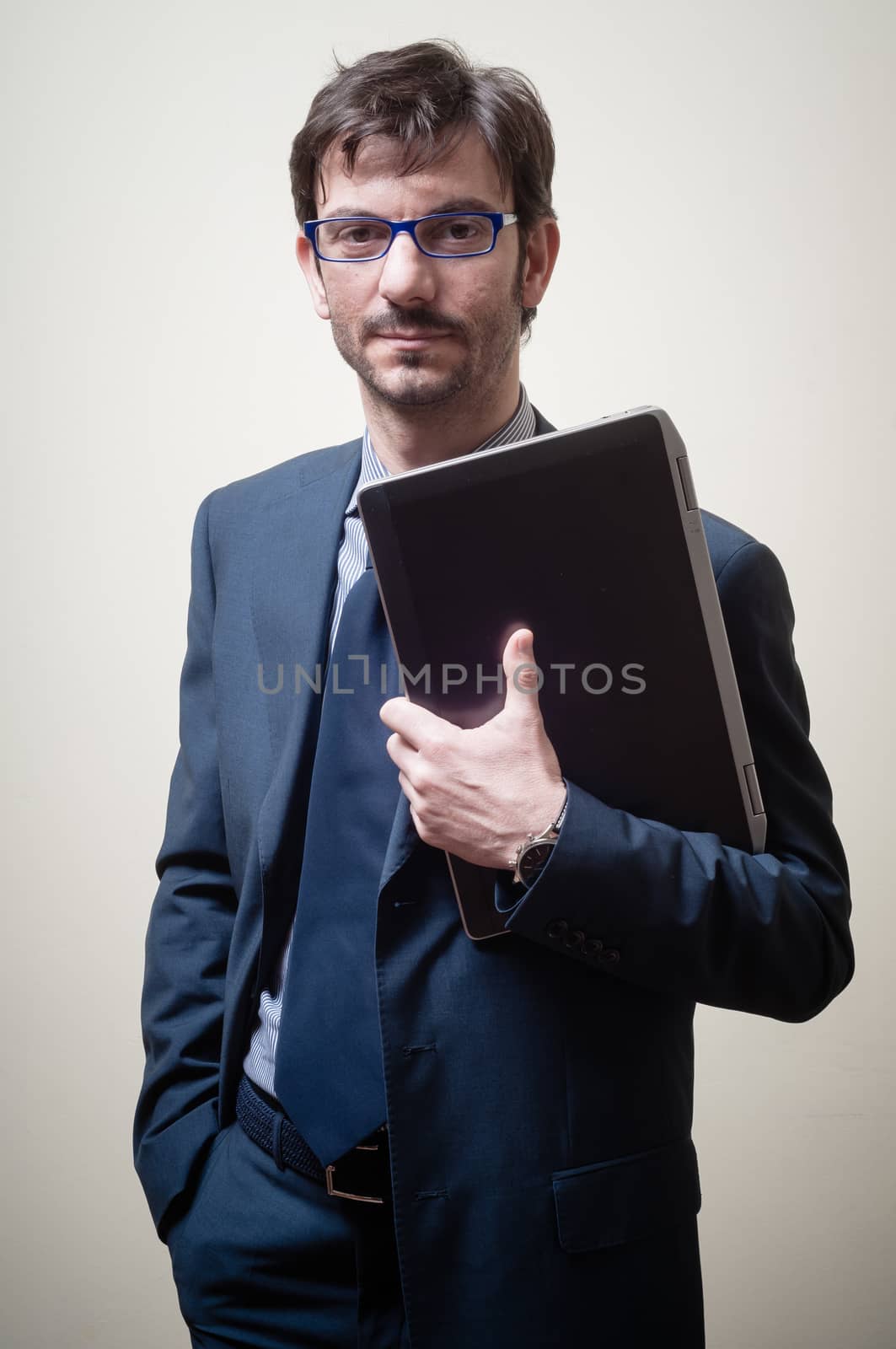 businessman with notebook on gray background