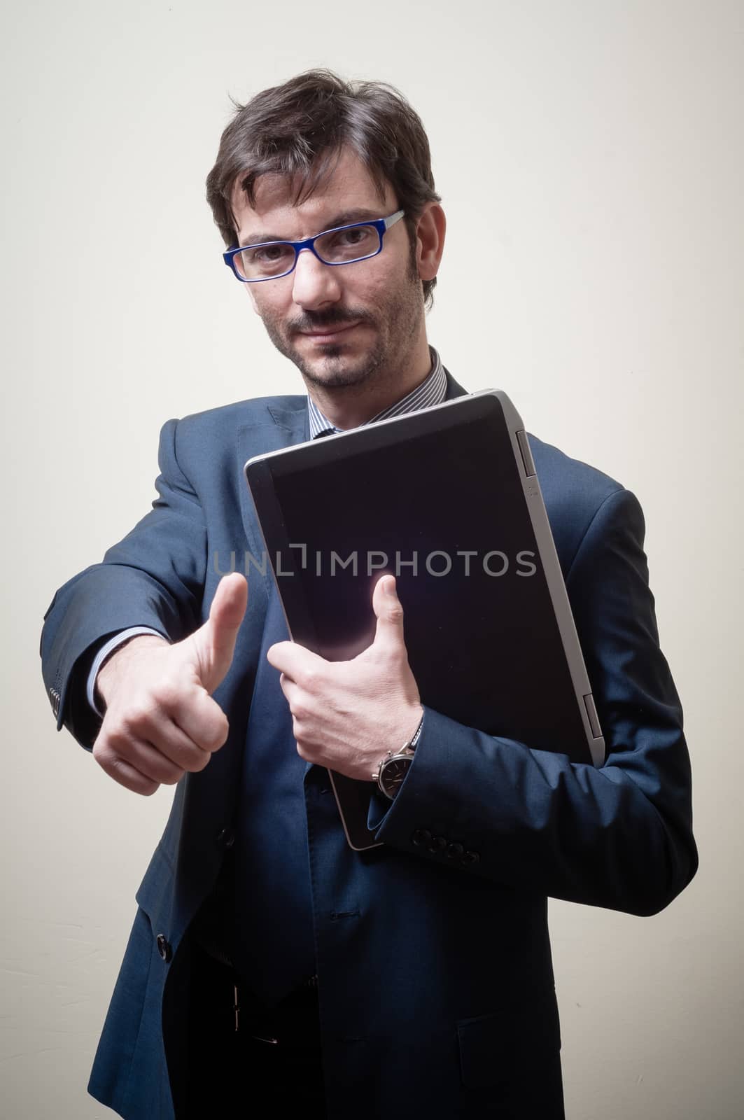 businessman with notebook on gray background