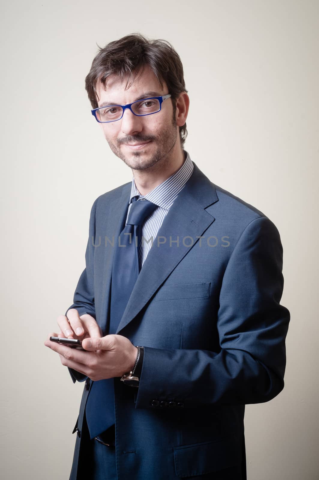 businessman on the phone on gray background