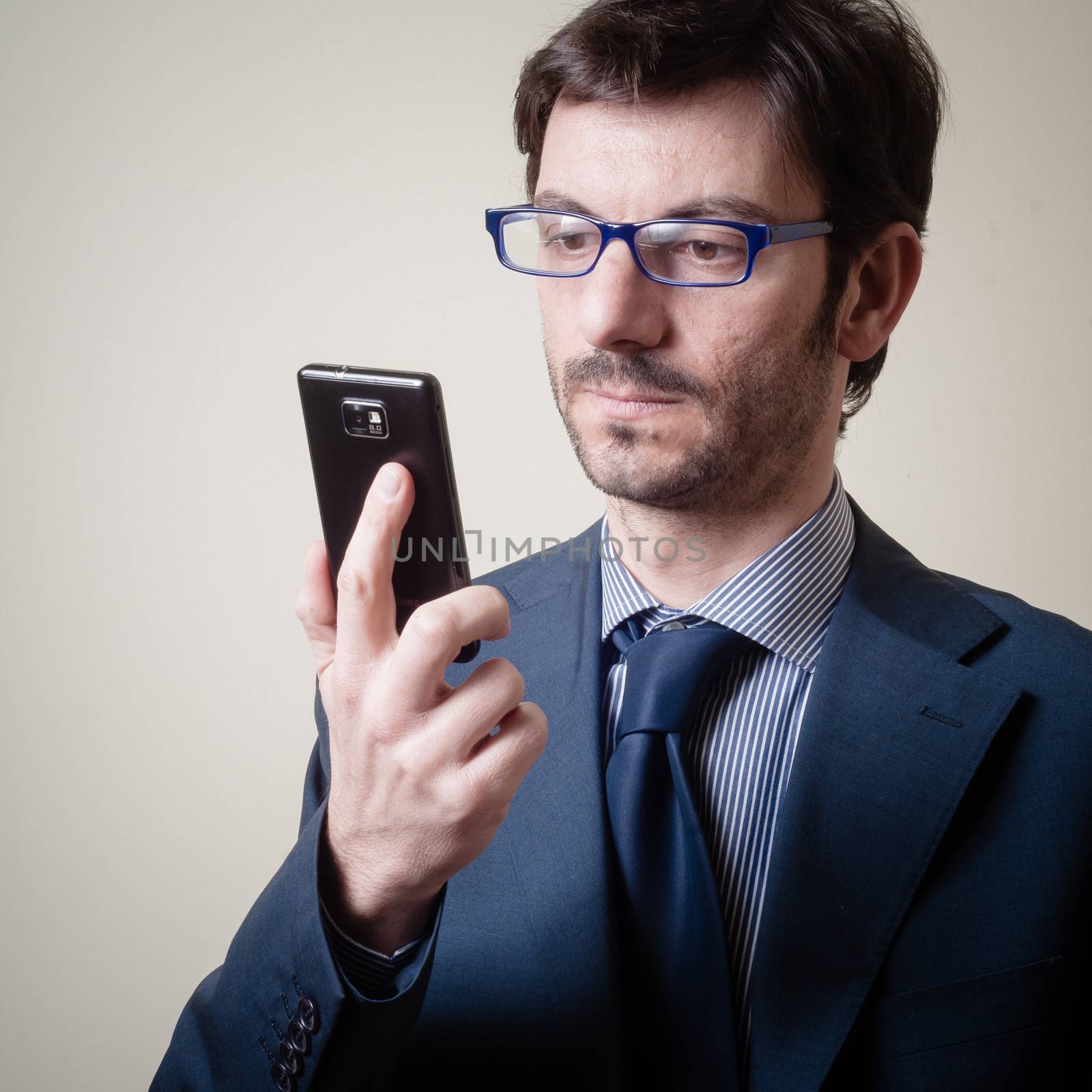 businessman on the phone on gray background