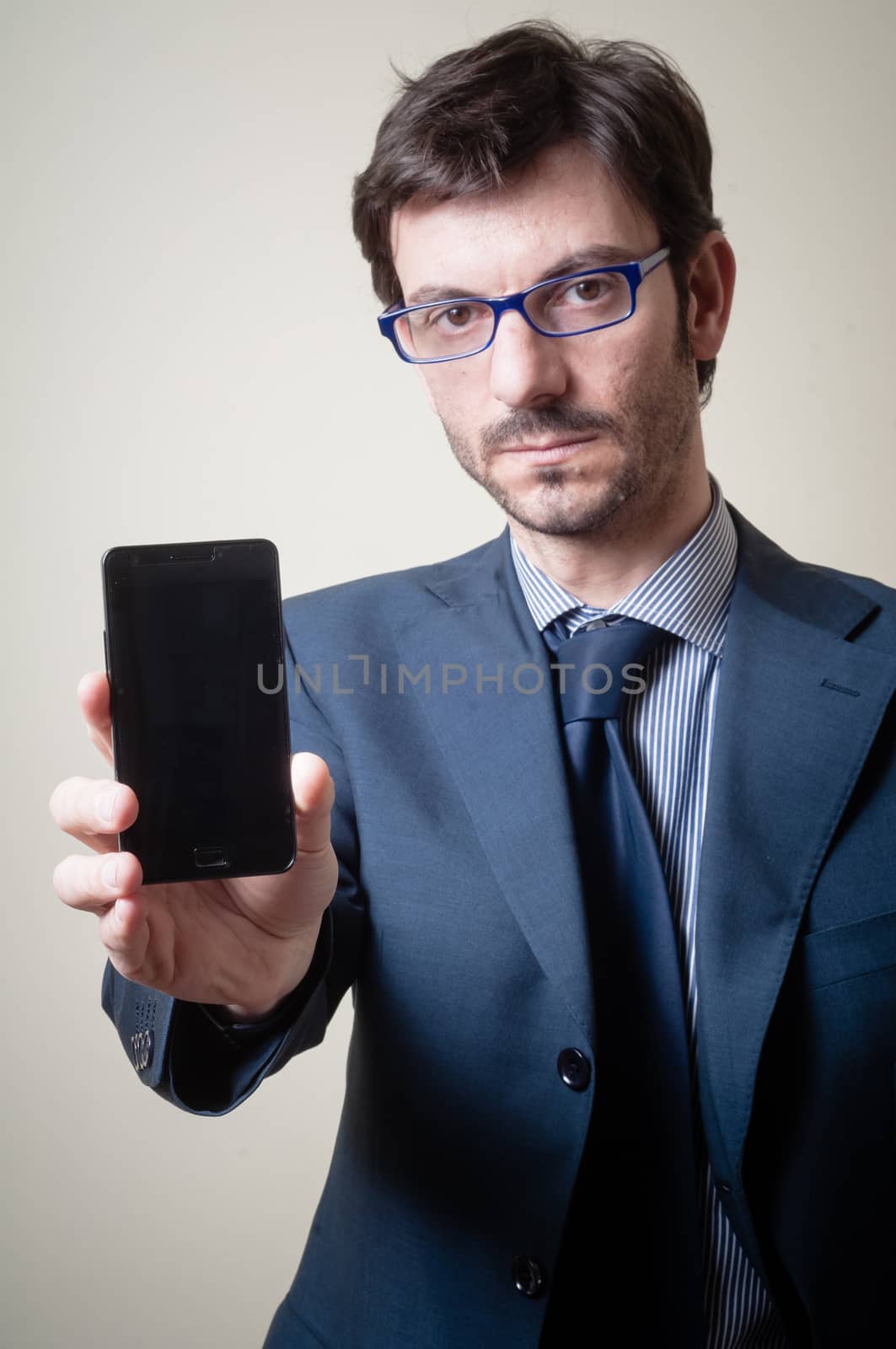 businessman on the phone on gray background