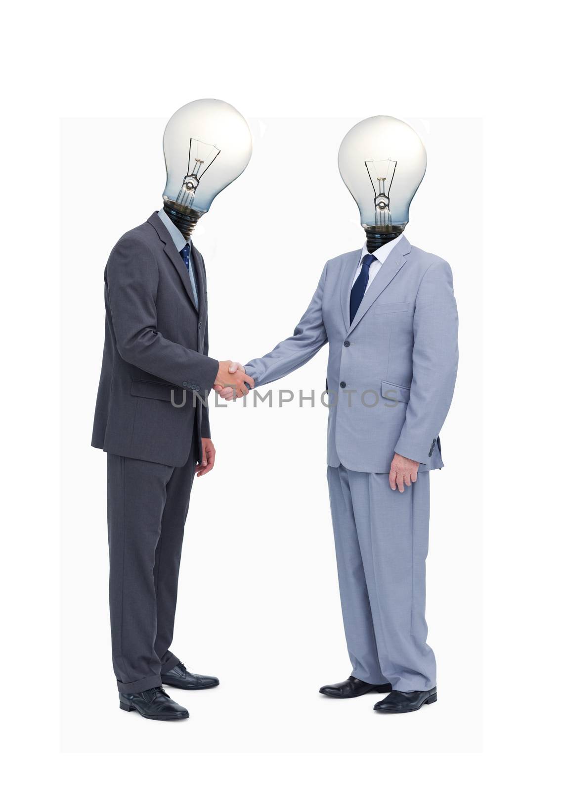 Businessman with light bulb heads greeting with a handshake against white background